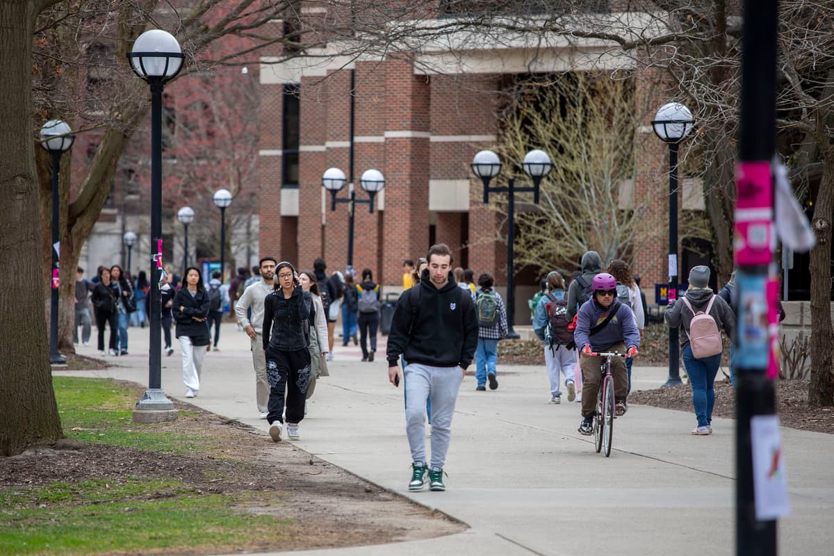 University of Michigan students walk on the UM campus at Ann Arbor, Michigan on April 3, 2025. 