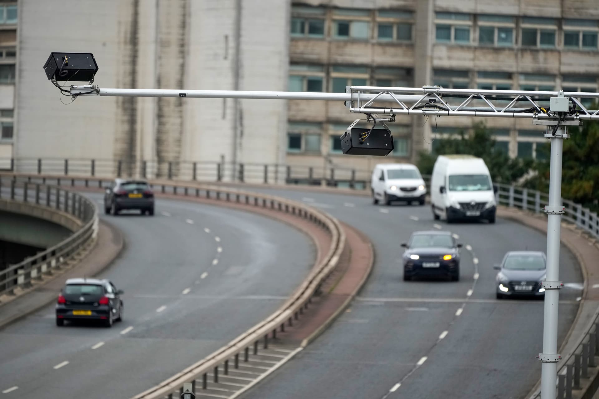 Cameras monitor traffic on a roadway in the United Kingdom.