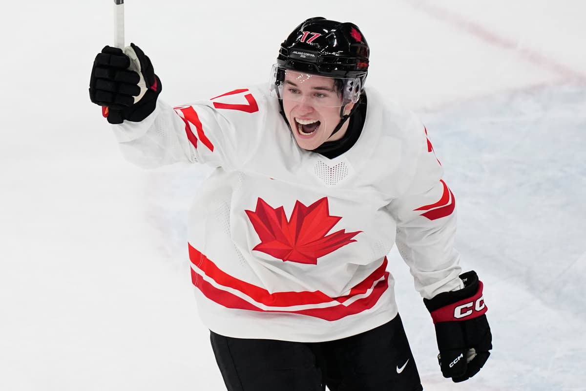 Canada's Macklin Celebrini celebrates after scoring his sides first goal during a preliminary round match of men's ice hockey between Czech Republic and Canada at the 2026 Winter Olympics.