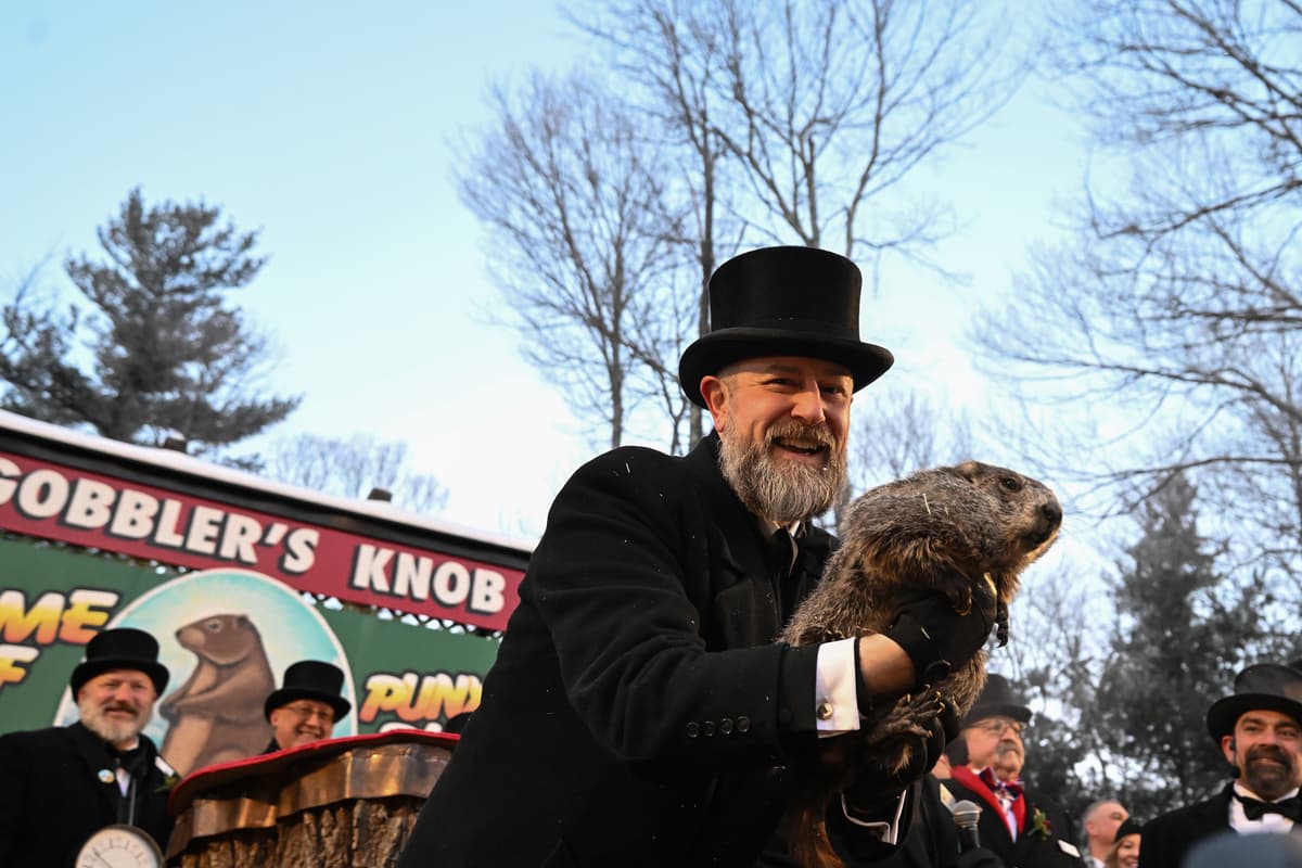 Handler A.J. Dereume holds Punxsutawney Phil, the weather prognosticating groundhog, during the 140th celebration of Groundhog Day on Gobbler's Knob at Punxsutawney, Pennsylvania, February 2, 2026.