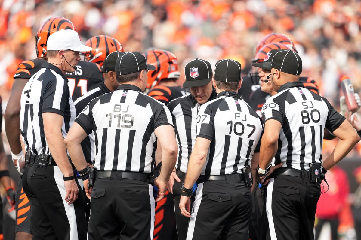 Members of the officiating crew consult during an NFL football game between the Arizona Cardinals and the Cincinnati Bengals at Cincinnati on December 28, 2025.