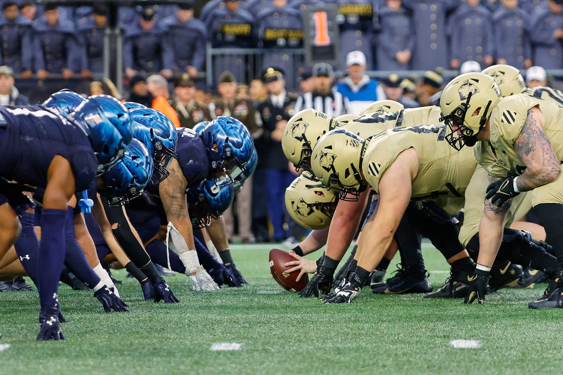 The Navy, left, and Army line up at the line of scrimmage during their annual football game on December 9, 2023, at Foxborough, Massachusetts.