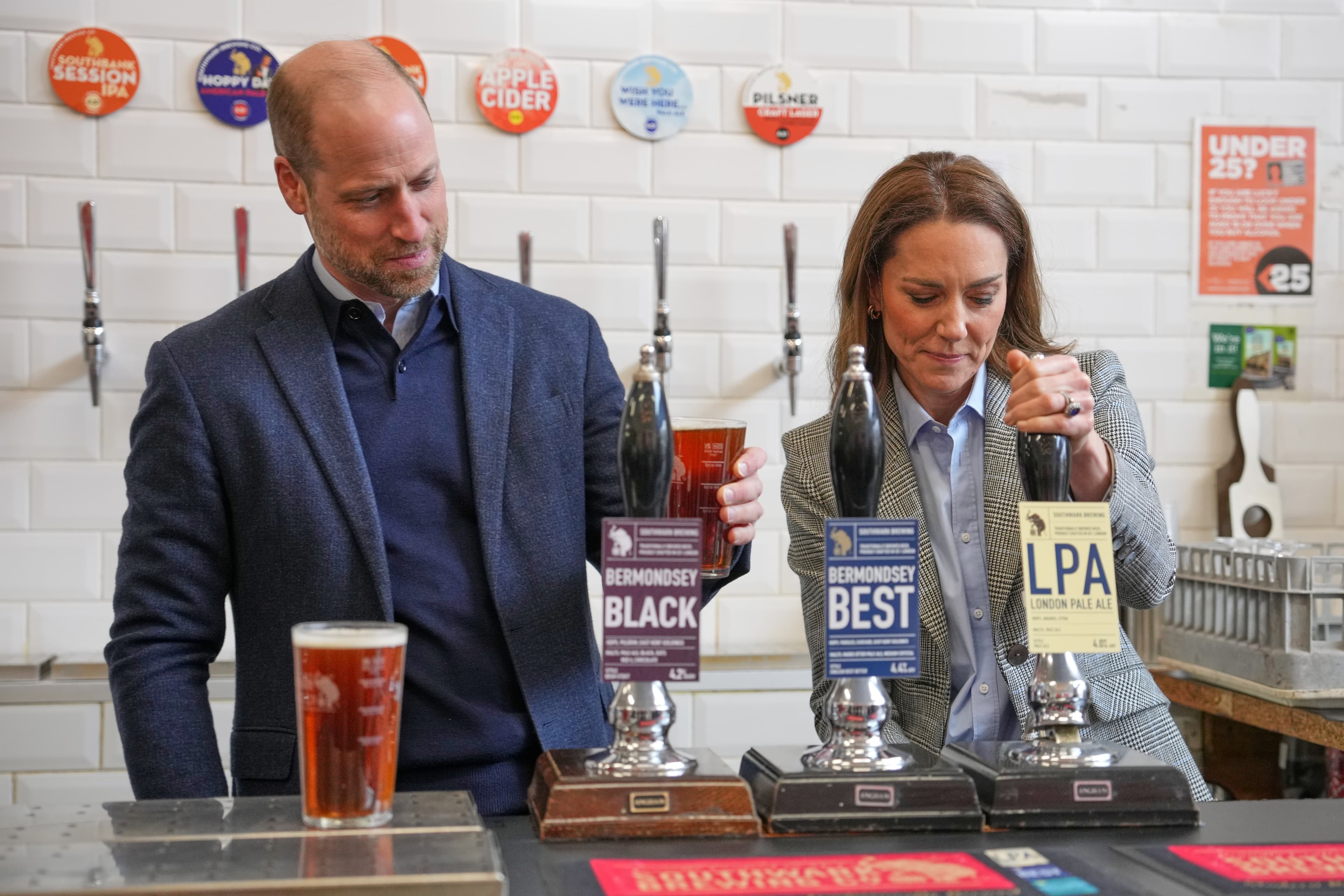 Prince William and his wife, Kate, draw beers during a visit to the Southwark Brewing Company at London on March 12, 2026.