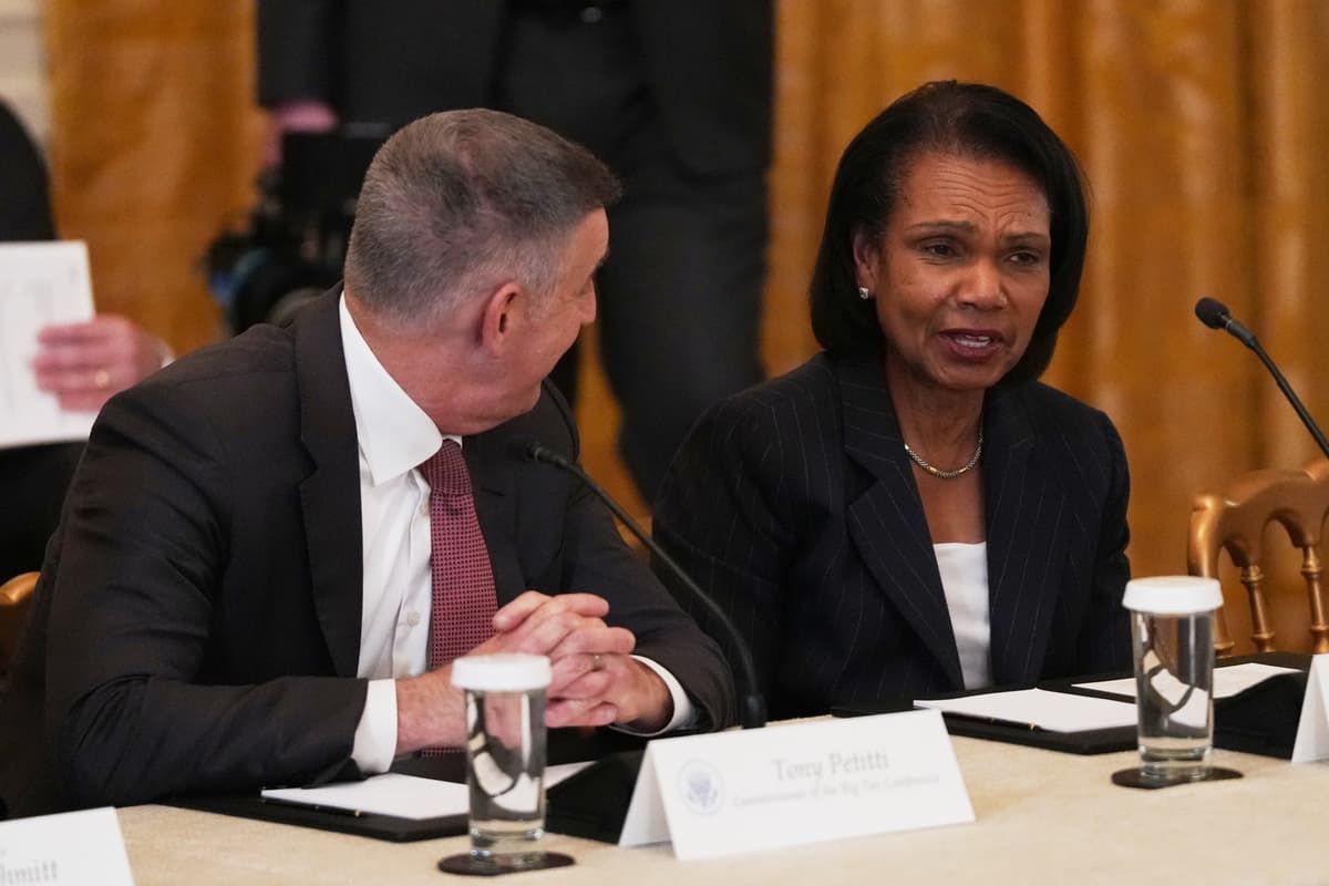 The Big Ten Conference commissioner, Tony Petitti, talks with the former secretary of state, Condoleezza Rice, before a roundtable discussion on college sports at the White House on March 6, 2026.
