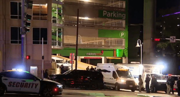 Police vehicles are seen outside the Children's Medical Center at Dallas, Texas, where a man identified as a security guard for Congresswoman Jasmine Crockett was fatally shot by SWAT officers on March 13, 2026.