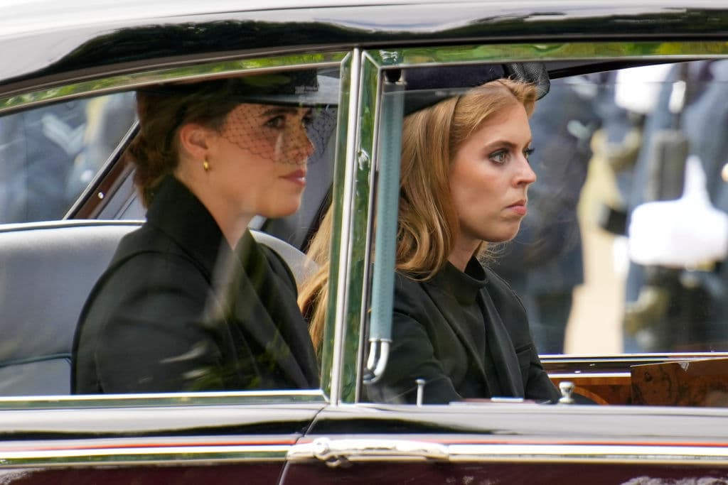 Princess Eugenie and Princess Beatrice are seen in a car following the State Funeral of Queen Elizabeth II at Westminster Abbey on September 19, 2022 at London.