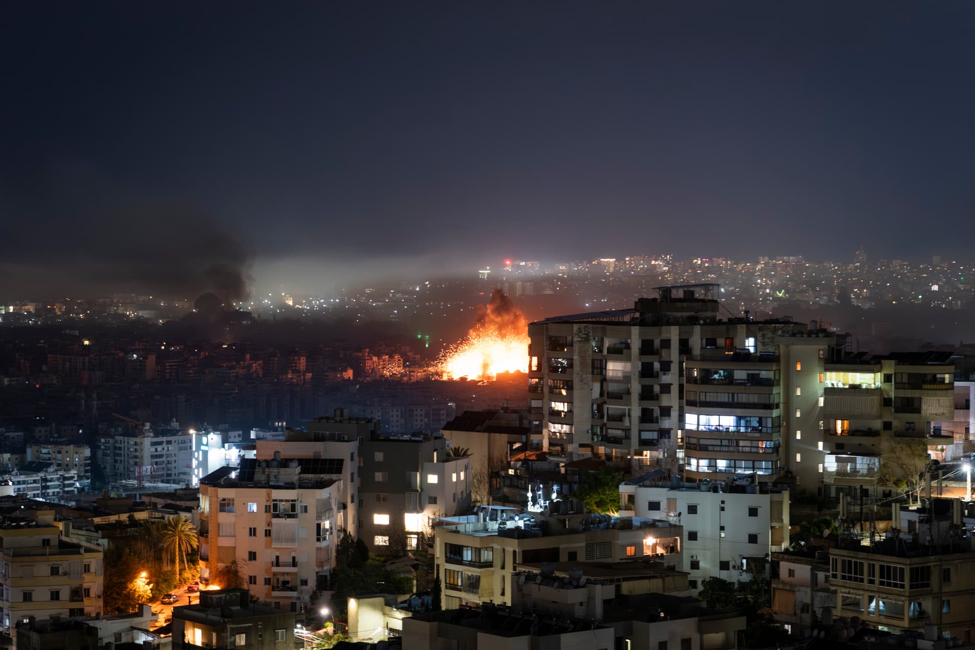 Smoke rises over Beirut's southern suburb of Dahieh following Israeli airstrikes after Hezbollah launched a barrage of rockets and announced a new phase of the war on March 11, 2026. 