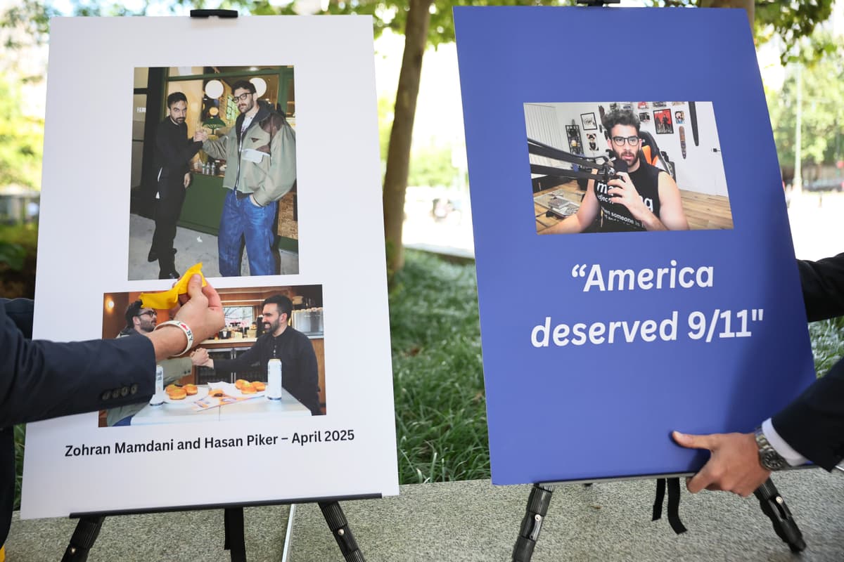 Staffers put up poster boards of the then mayoral candidate, Zohran Mamdani, and influencer Hasan Piker before a press conference with the former New York governor, Andrew Cuomo, at New York City on September 9, 2025.