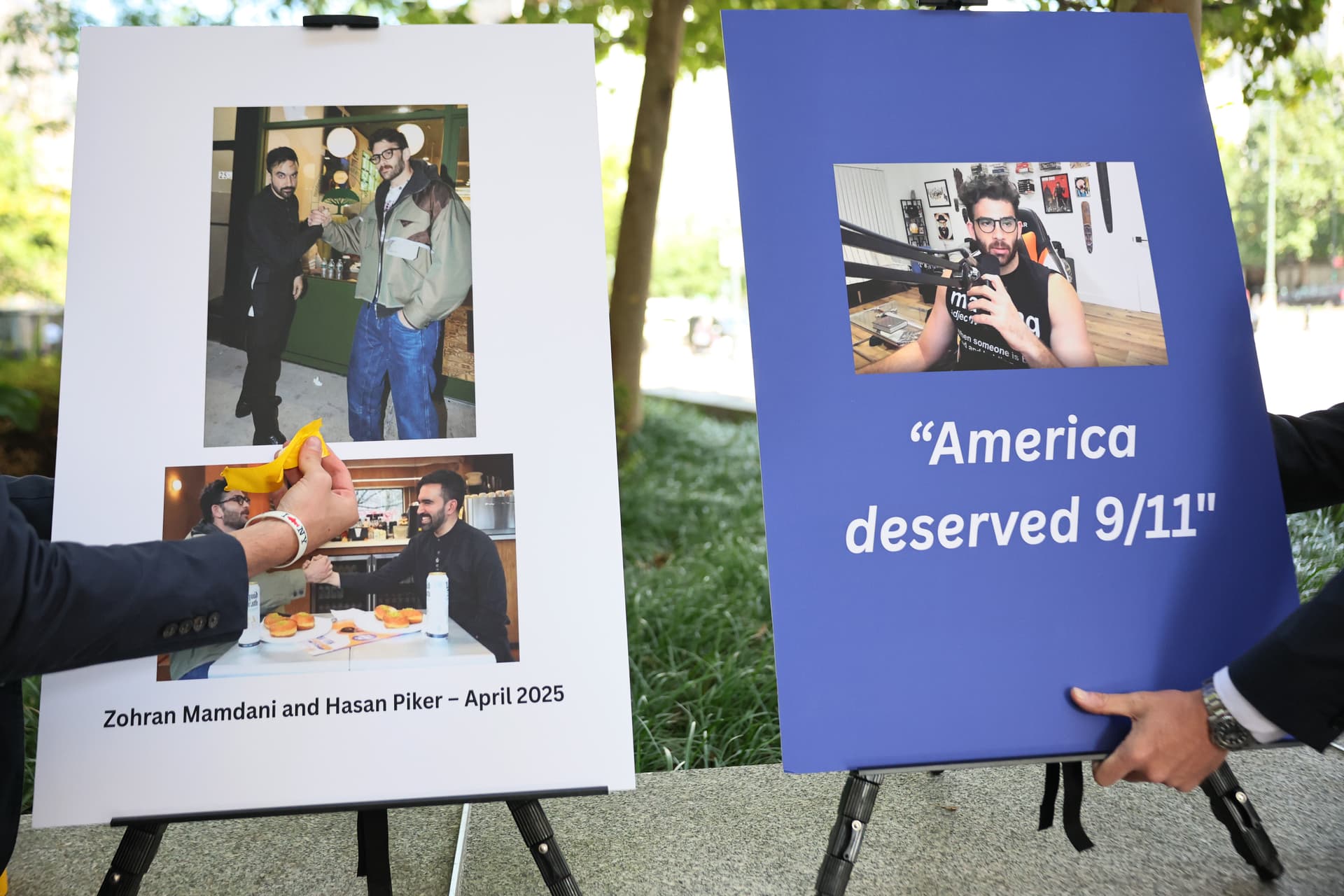 Staffers put up poster boards of the then mayoral candidate, Zohran Mamdani, and influencer Hasan Piker before a press conference with the former New York governor, Andrew Cuomo, at New York City on September 9, 2025.