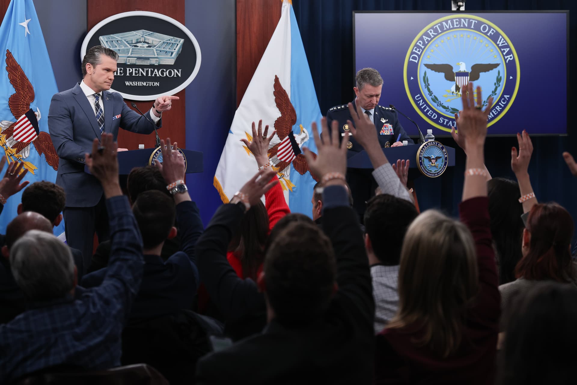 Defense Secretary Pete Hegseth answers questions with the chairman of the Joint Chiefs of Staff, General Dan Caine, during a press briefing at the Pentagon on March 19, 2026.