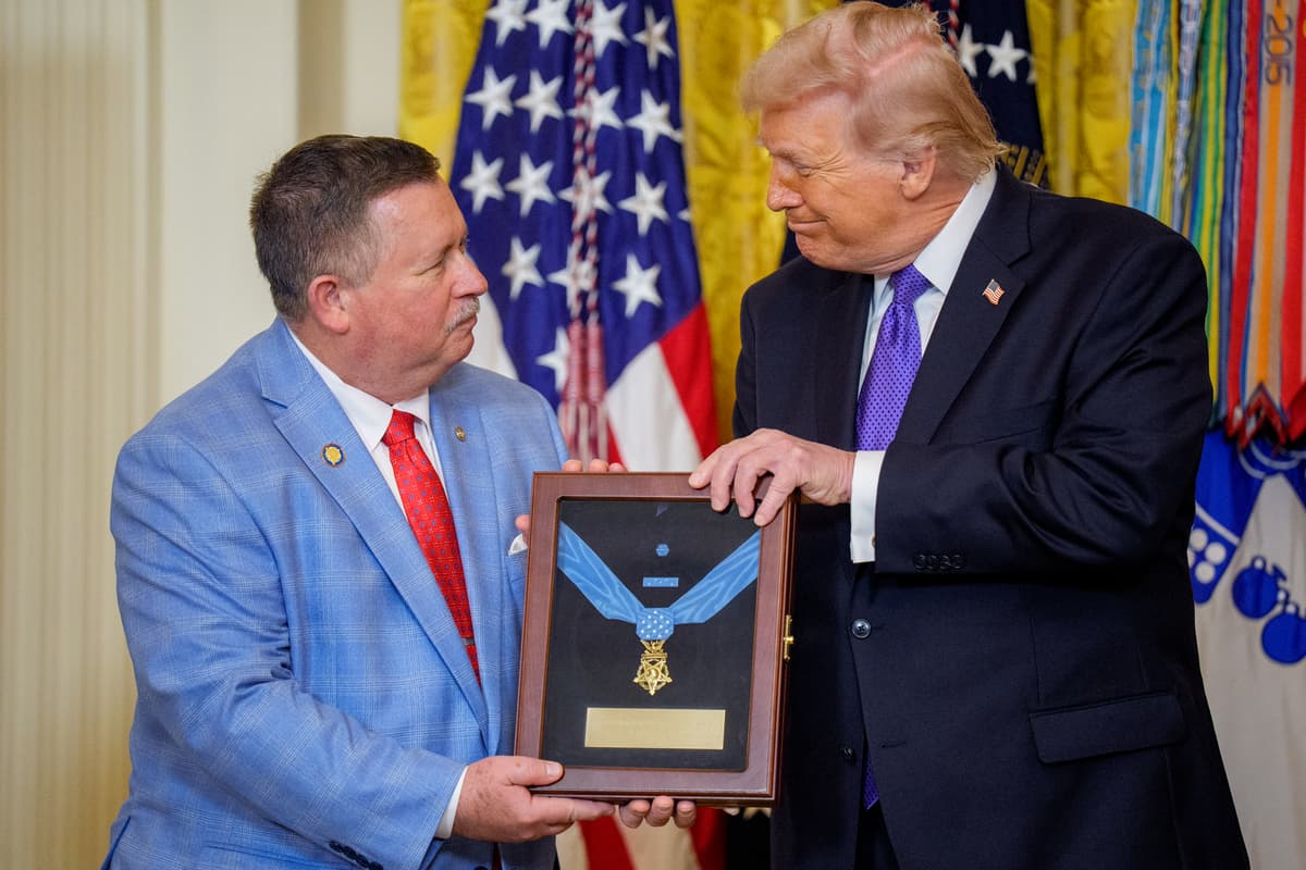 Chris Edmonds, son of Master Sergeant Roderick (Roddie) W. Edmonds, U.S. Army, is presented with his father's Medal of Honor by President Trump during a ceremony in the East Room of the White House on March 2, 2026 in Washington, D.C. 