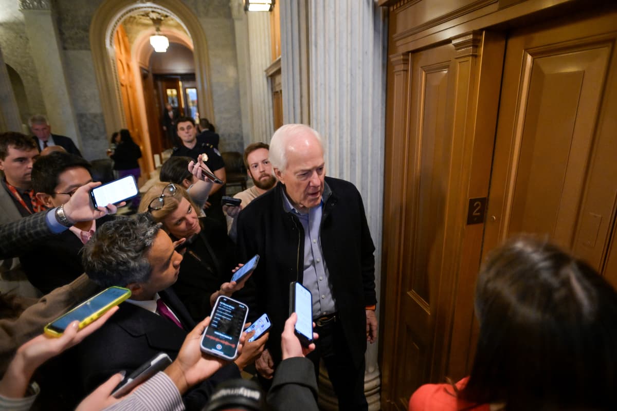 Senator John Cornyn talks with reporters as he leaves the Senate chamber during a Senate war powers vote on Iran on Capitol Hill, March 4, 2026.