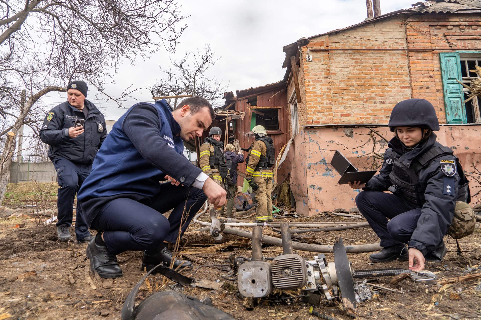 Authorities examine the fragments of a Russian drone after an air attack at Kharkiv, Ukraine, March 25, 2026.