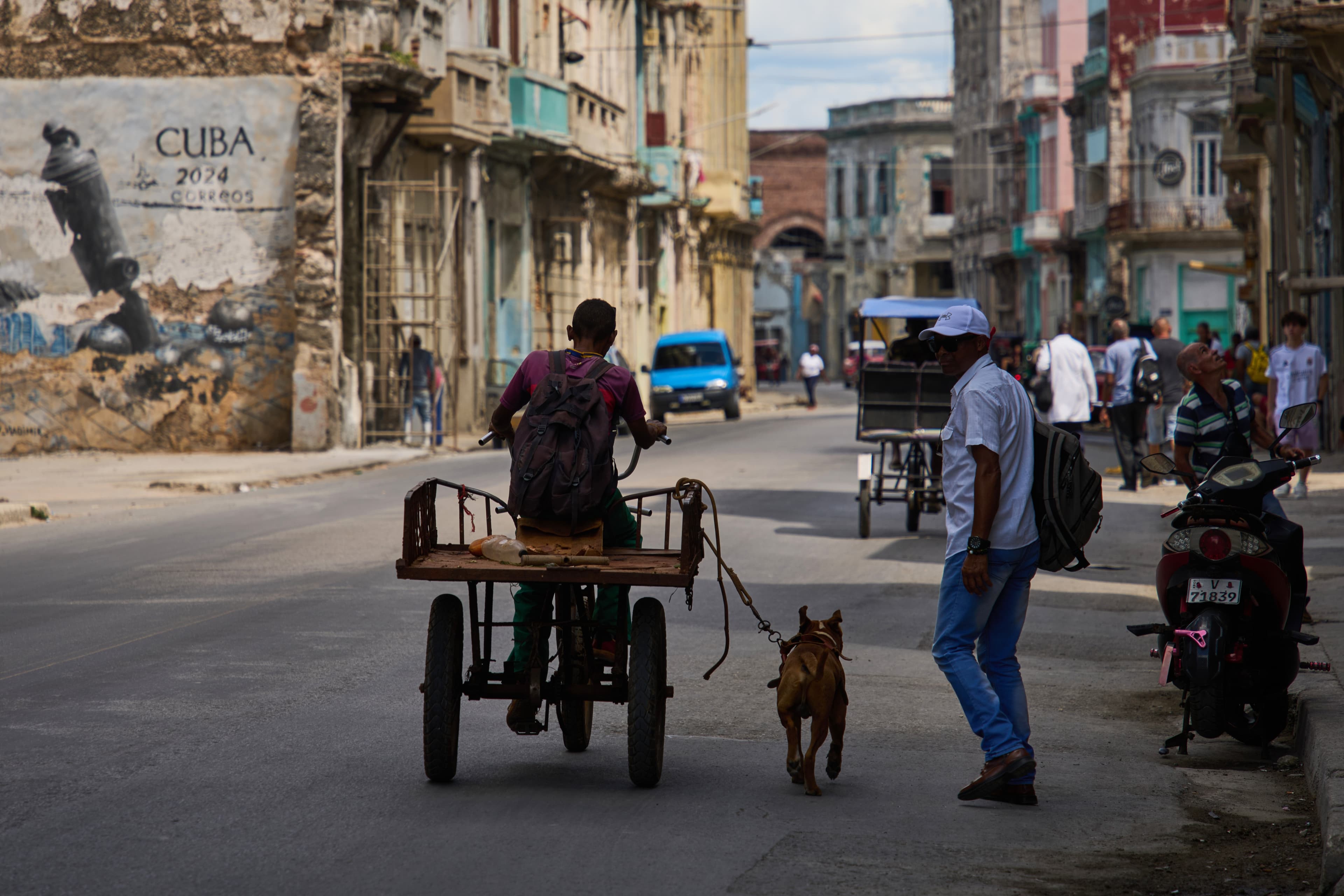 A man rides a tricycle during a blackout at Havana, Cuba, March 16, 2026.