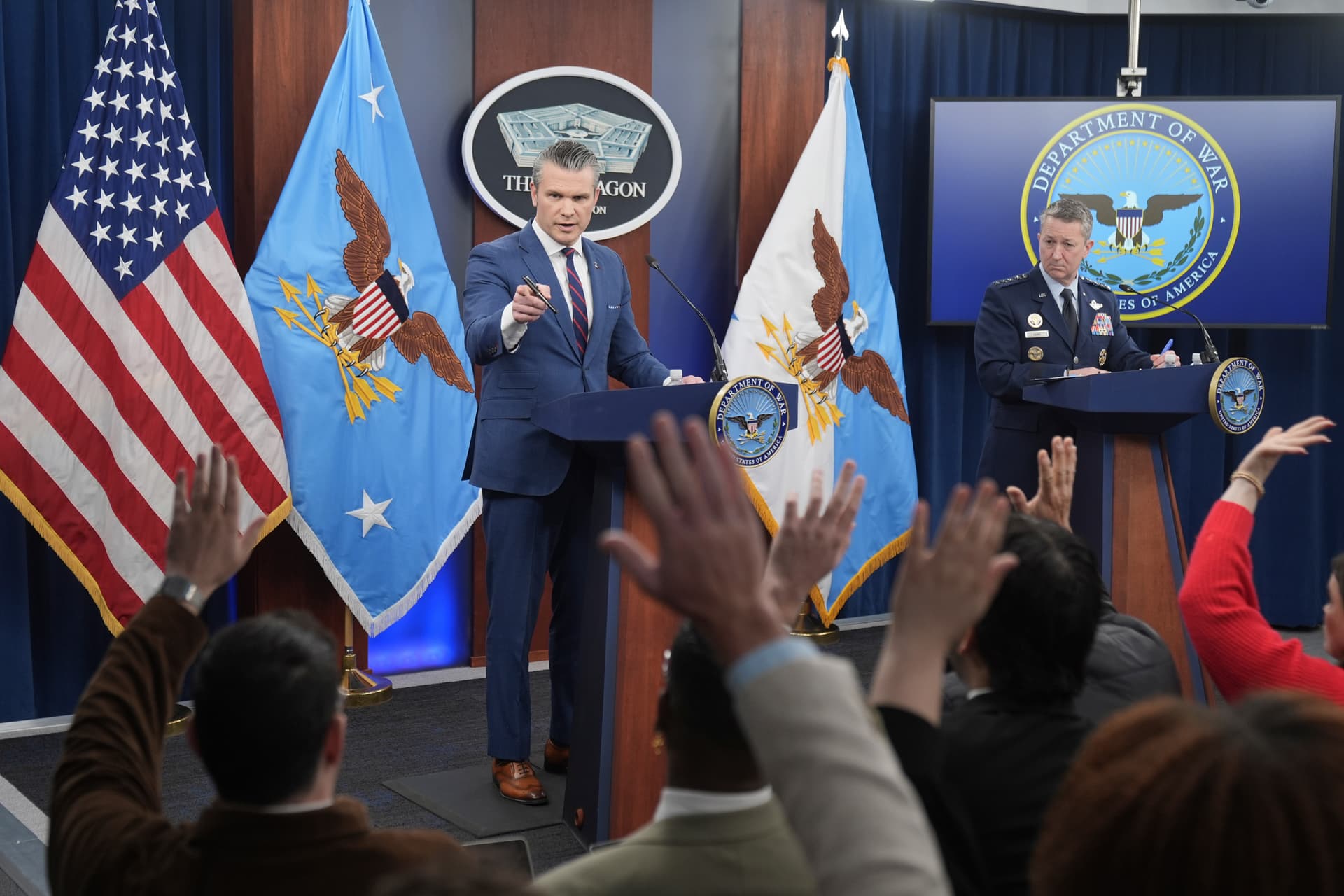Defense Secretary Pete Hegseth and Chairman of the Joint Chiefs of Staff General Dan Caine take questions during a press briefing at the Pentagon, Monday.
