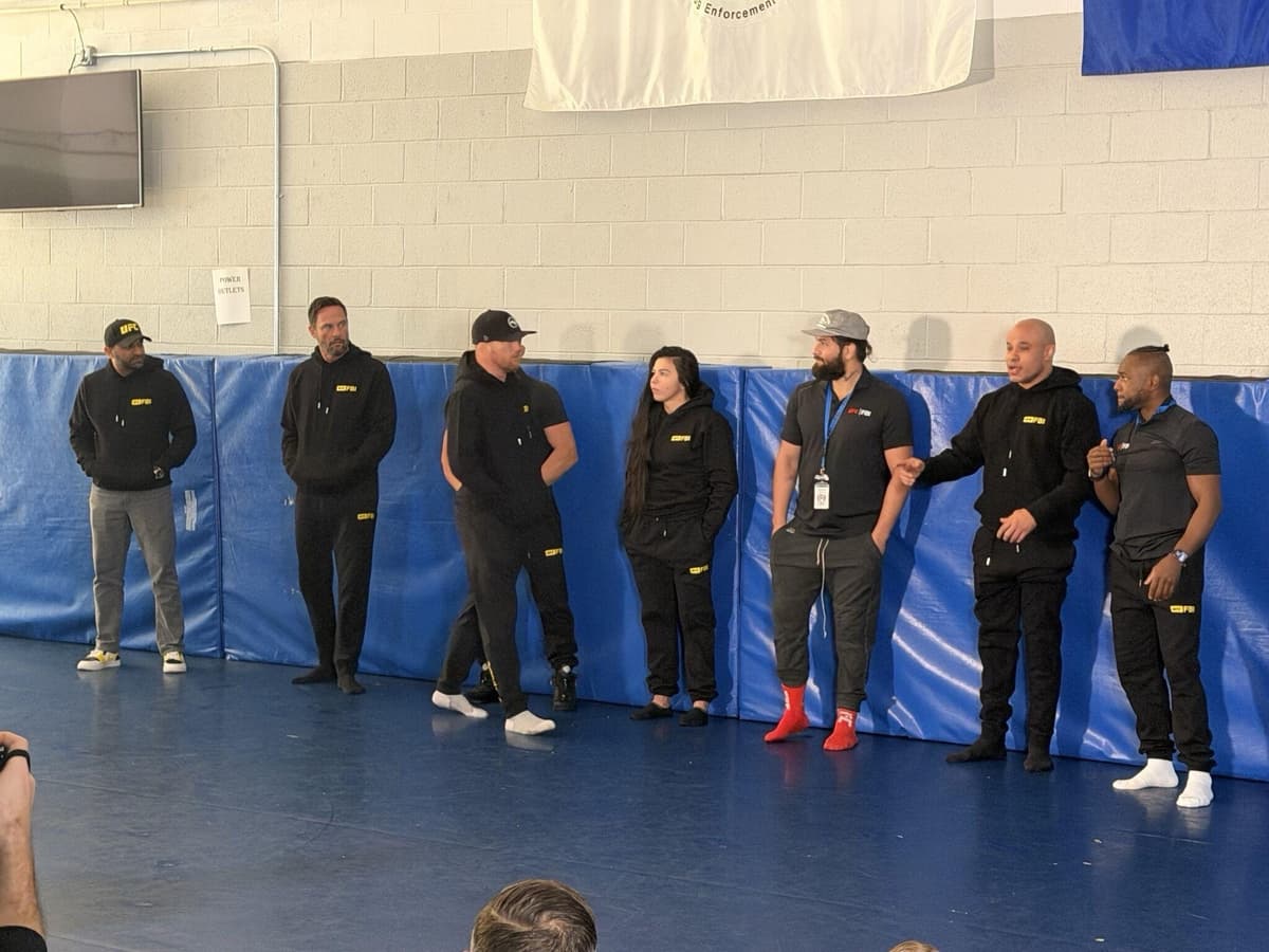 The FBI director, Kash Patel, (far left) stands alongside MMA fighters at Quantico Sunday.