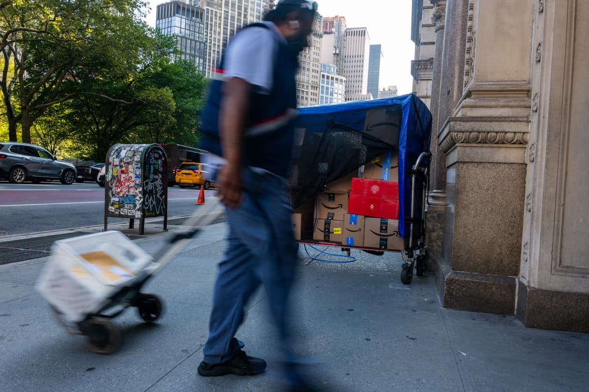 A postal worker delivers mail in Manhattan.