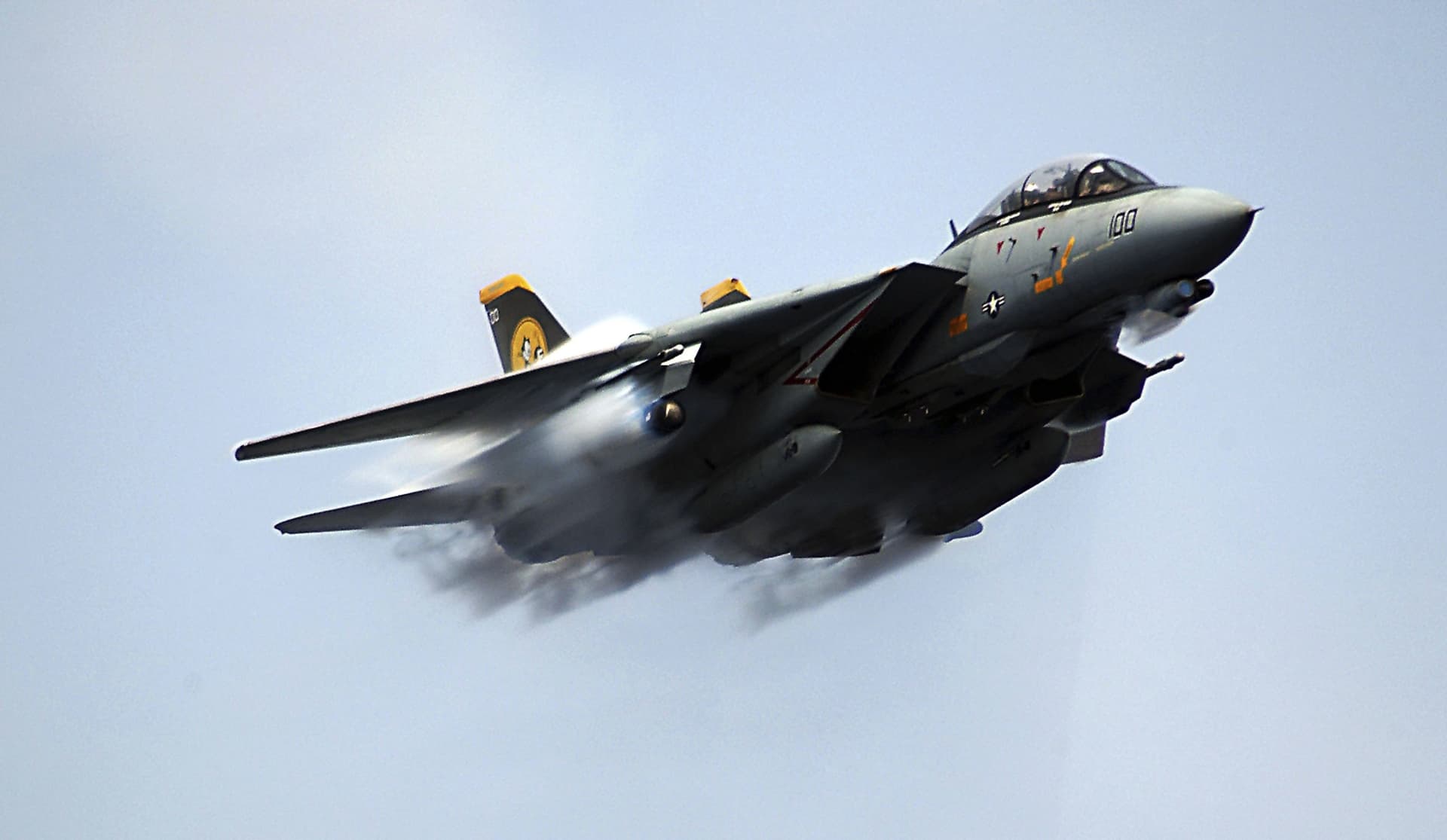 An F-14D Tomcat assigned to the 'Tomcatters' of Fighter Squadron Three One (VF-31), makes a near supersonic fly-by above the flightdeck of the USS Theodore Roosevelt on July 28, 2006 at Sea.