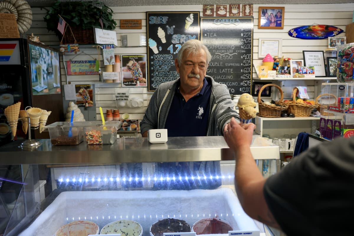 Don Vaskovic works at his Surf and Spray ice cream shop on February 10, 2026 in Hollywood, Florida. Hollywood, also known as the 'Quebec of the South,' has seen fewer French-Canadian tourists.