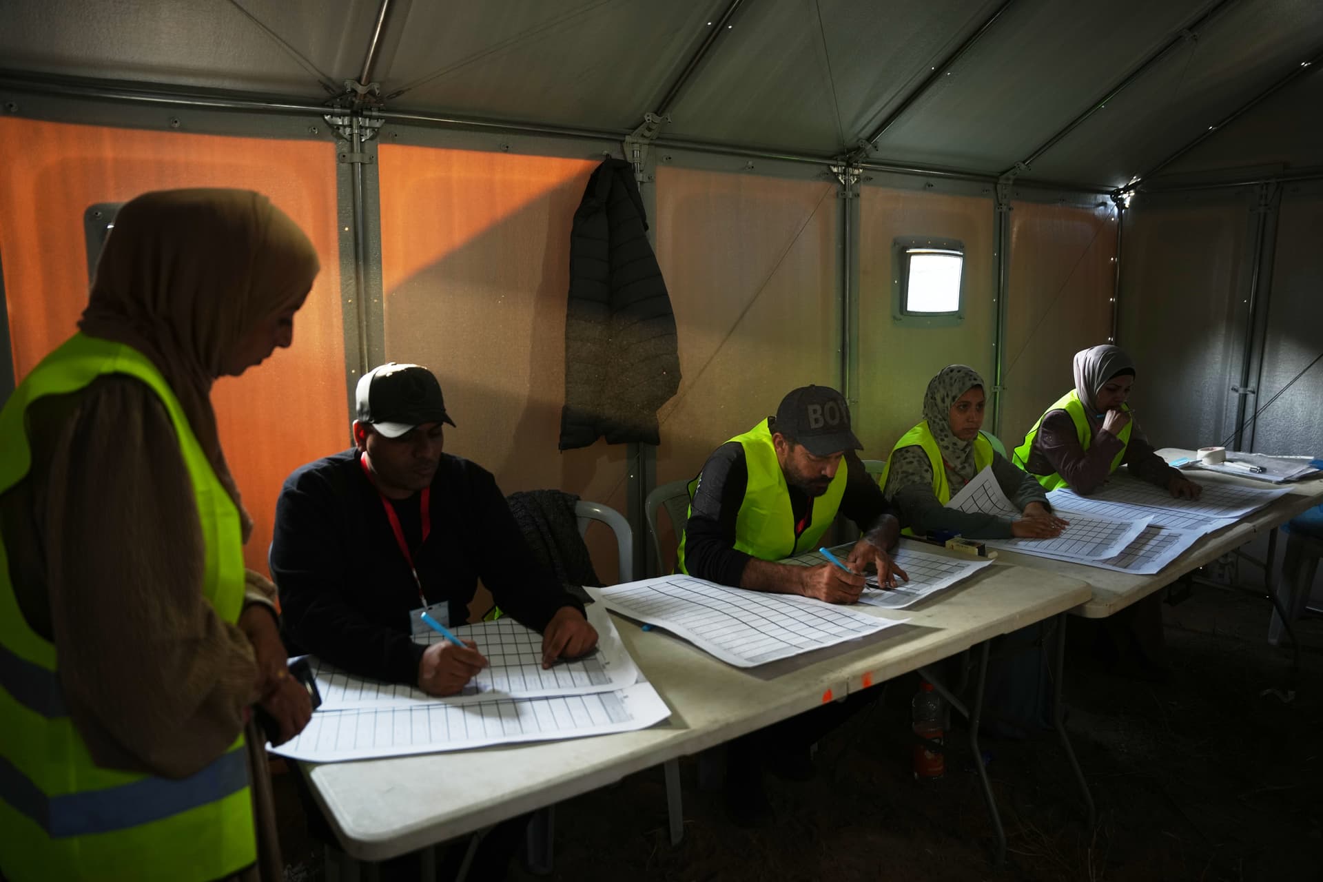 An election committee at Deir al-Balah, in central Gaza Strip sorts the lists of candidates in local elections, the first in two decades in Gaza, and the first in the occupied West Bank since 2022, on April 25, 2026. 