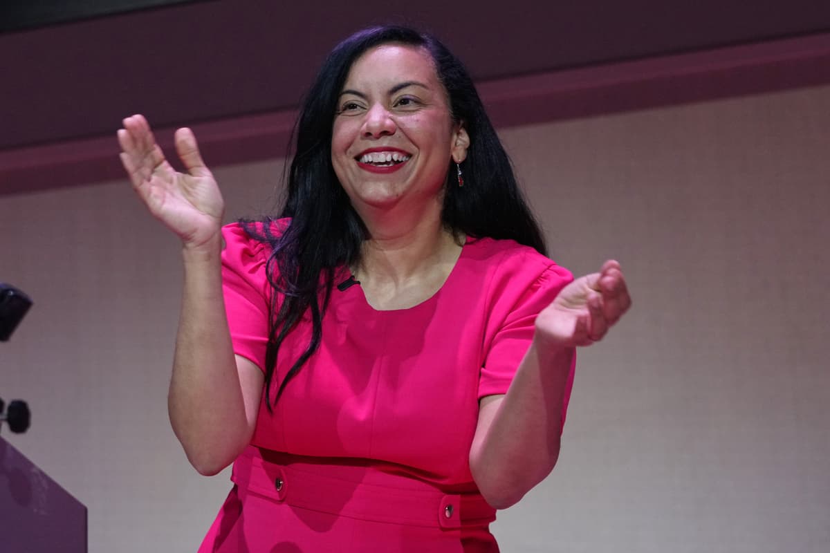 Analilia Mejia smiles as she gestures to supporters after winning New Jersey's 11th Congressional District special election, April 16, 2026, in Montclair, New Jersey.