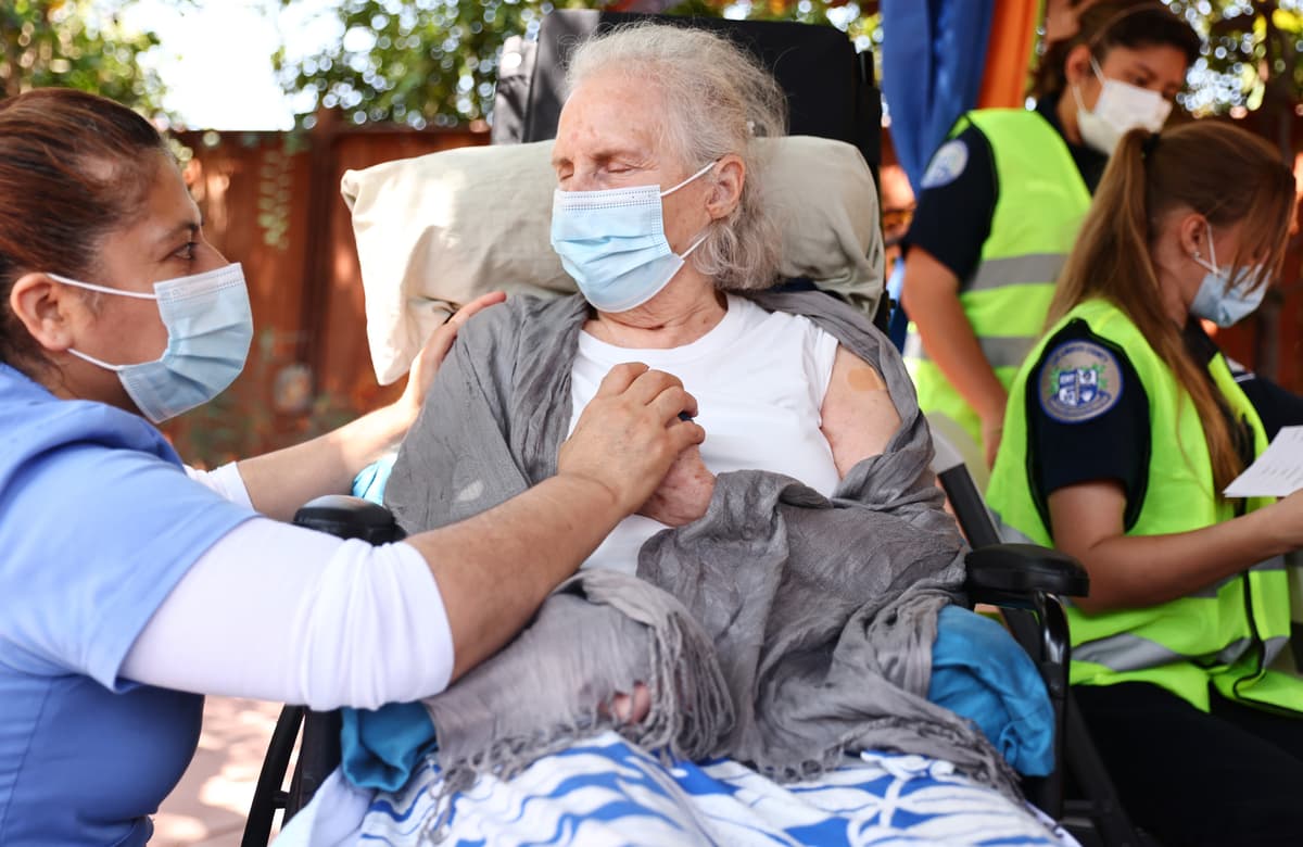 Dementia sufferer Marilyn Lurie is monitored by caregivers after receiving a Covid vaccination at Los Angeles on July 16, 2021.