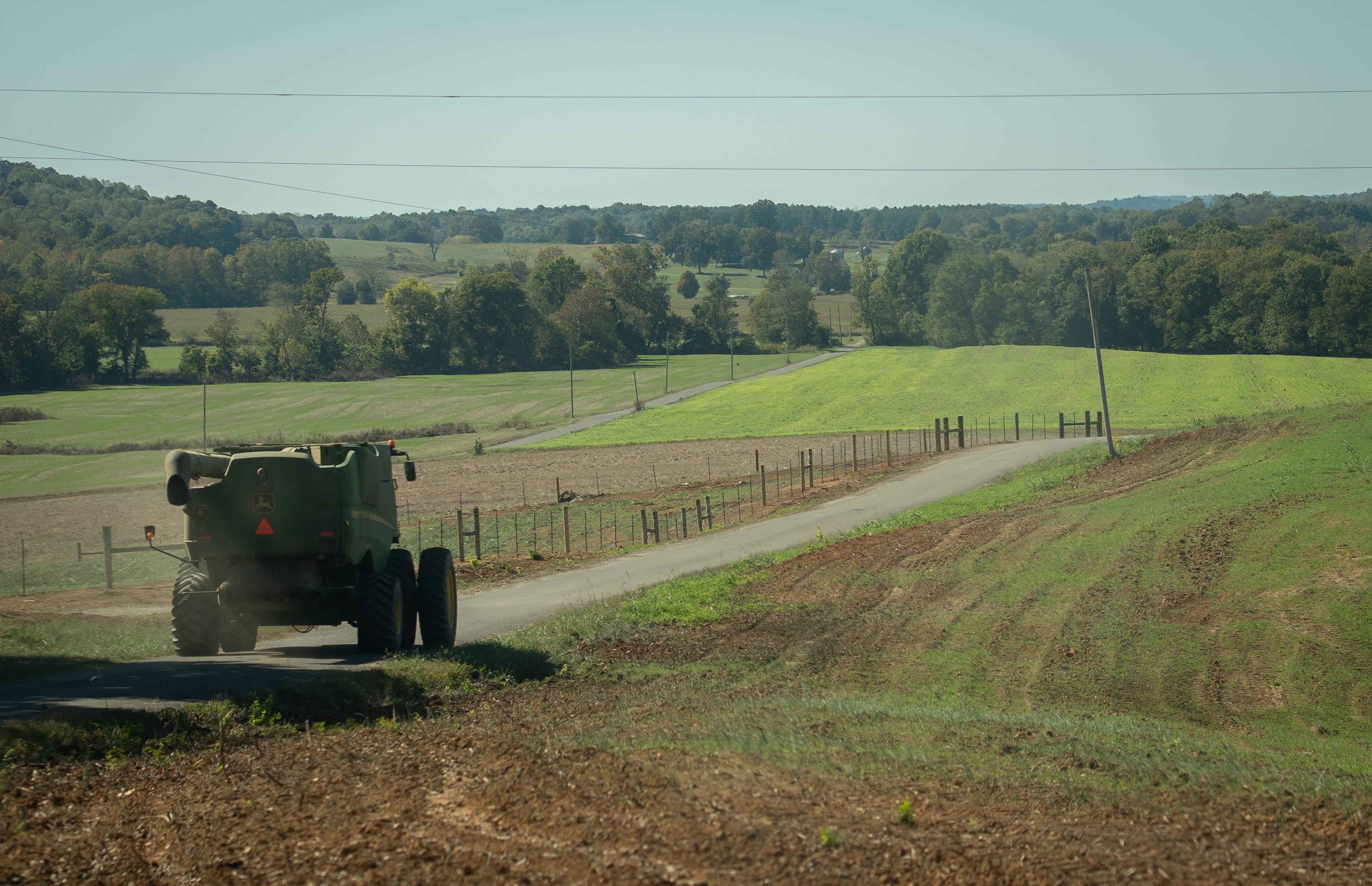 A farm truck drives near soybean fields at Marion, Kentucky, on October 14, 2025. 