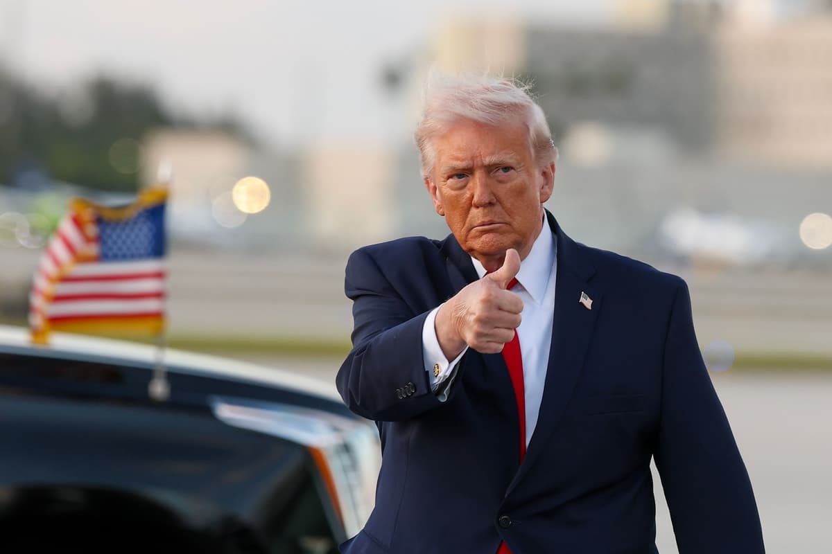 President Trump waves to the media after walking off of Air Force One at Miami International Airport on April 11, 2026 at Miami, Florida. 