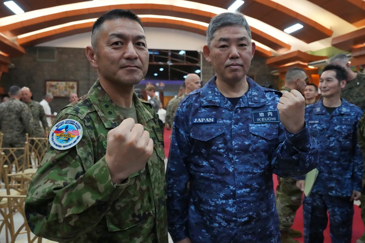 Major General Toshikatsu Musha, left, and Rear Admiral Izuru Ikeuchi of the Japanese army and navy pose during the opening ceremonies of the joint military exercise dubbed "Balikatan" or "Shoulder to Shoulder," at Quezon city, Philippines on April 20, 2026.