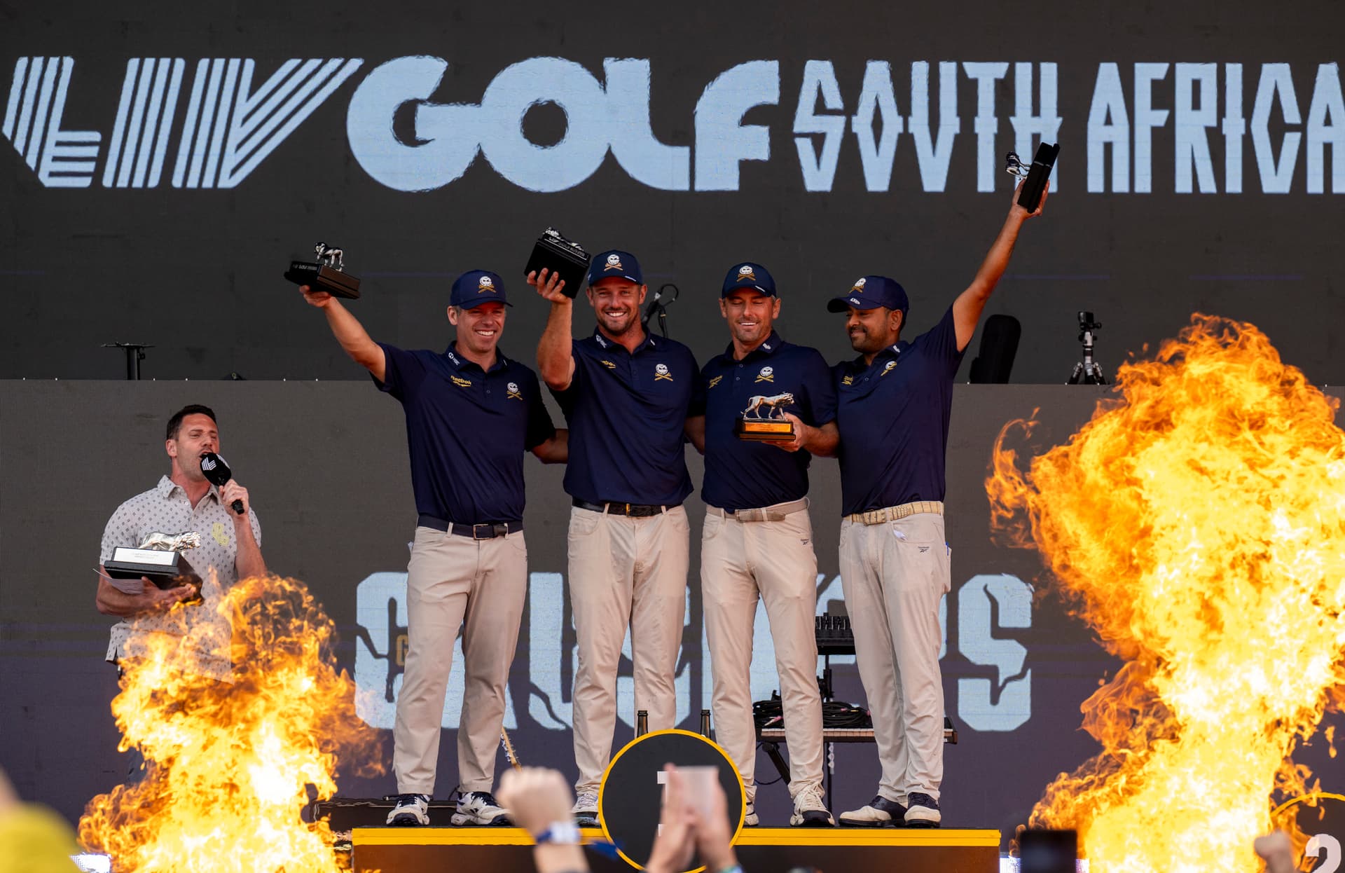 Bryson DeChambeau (center) and fellow Crushers GC react with trophy during day four of LIV Golf South Africa at The Club at Steyn City on March 22, 2026 in Johannesburg. 