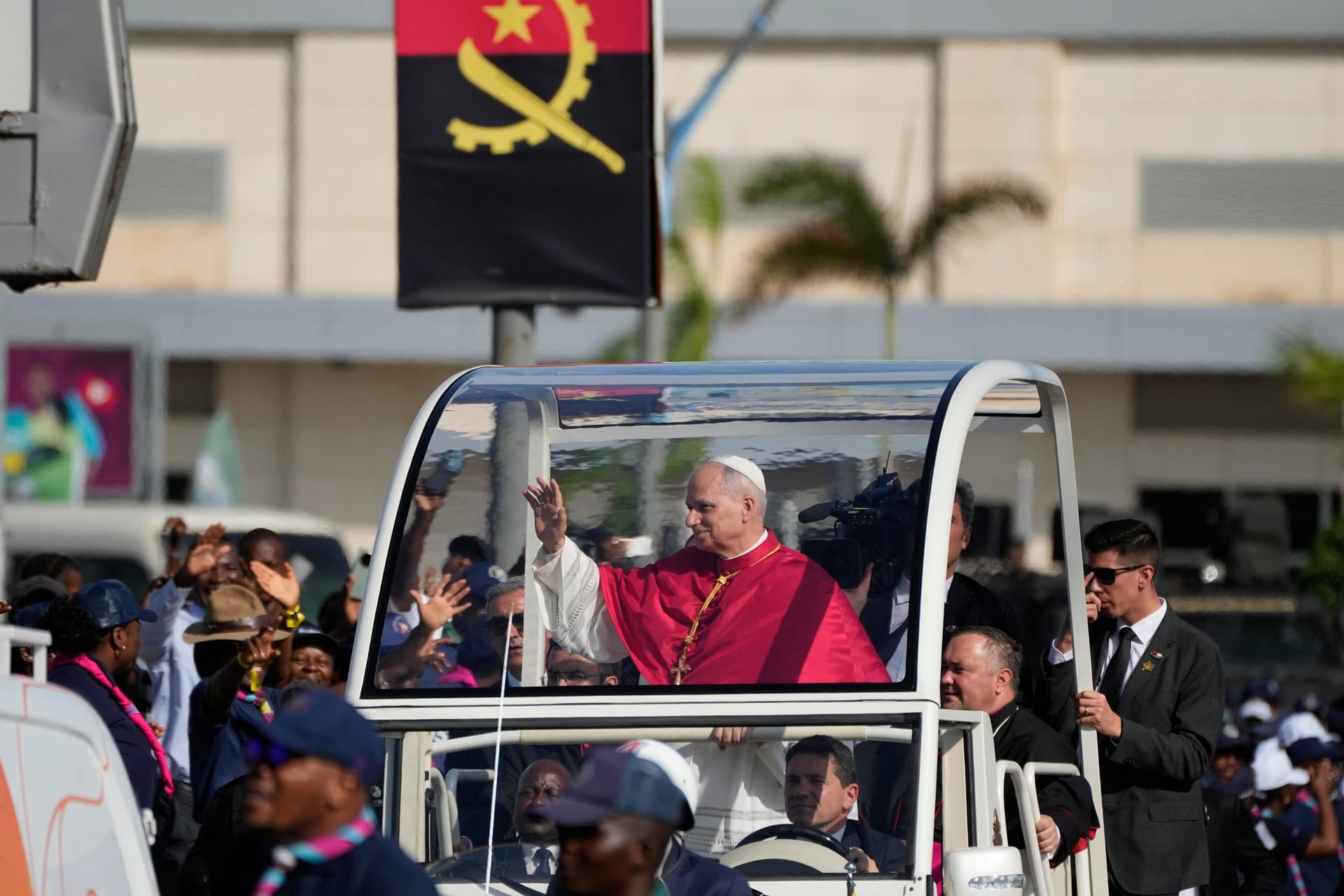 Pope Leo XIV waves after arriving at Luanda, Angola, on April 18, 2026.