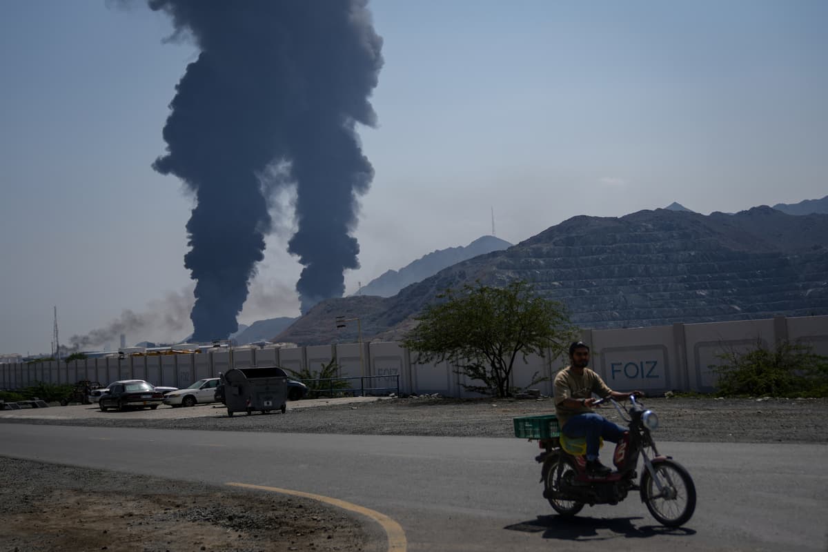 Plumes of smoke rise after debris from an intercepted Iranian drone struck an oil facility at Fujairah, United Arab Emirates, on March 14, 2026.