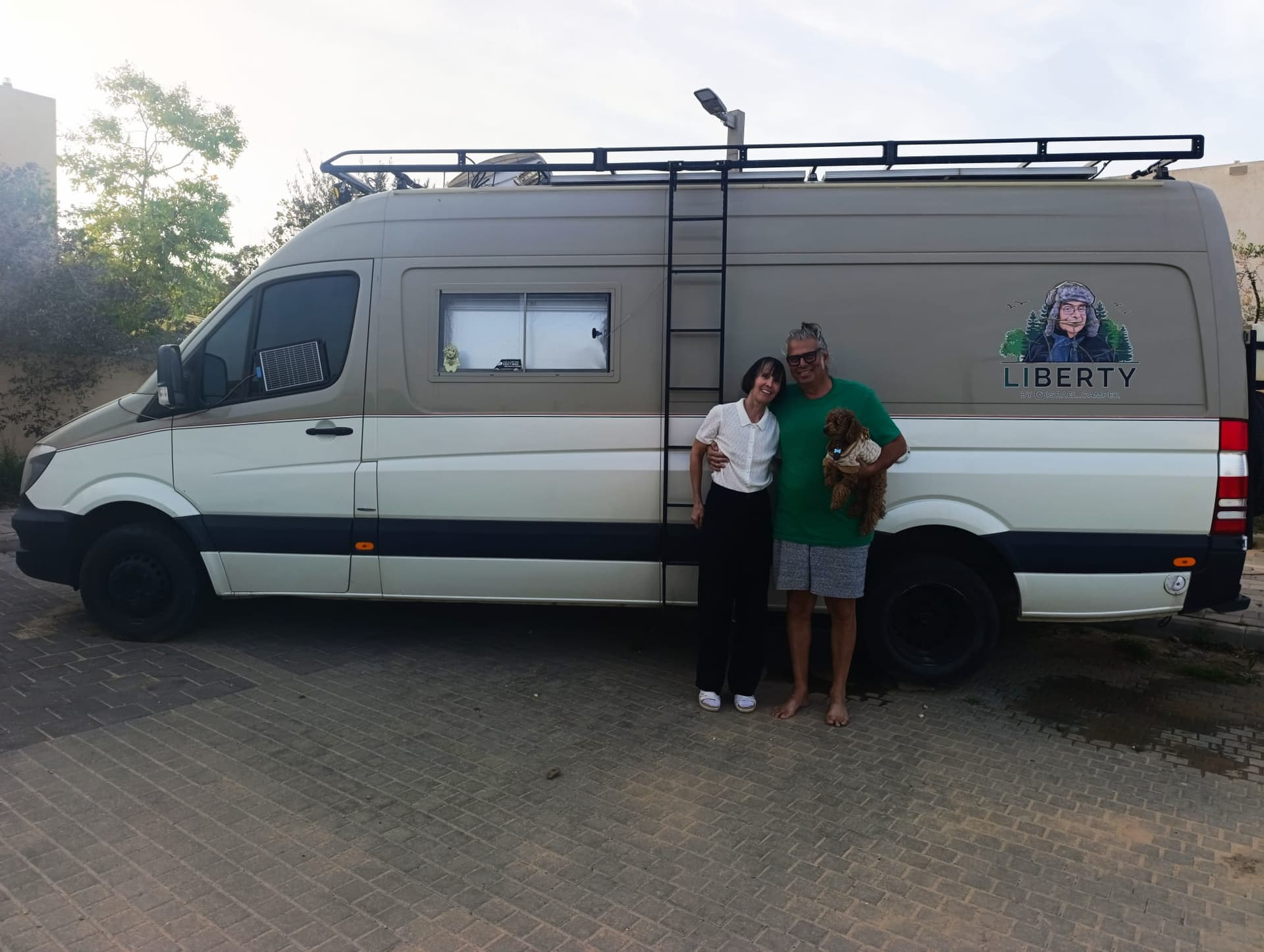 Osnat and Amir Melzer in front of their RV home in southern Israel.