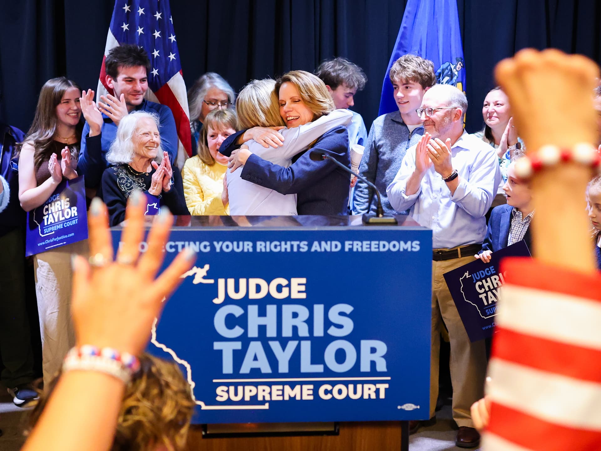 Wisconsin State Supreme Court Justice-elect Chris Taylor, right, hugs state Supreme Court Chief Justice Jill J. Karofsky on April 7, 2026, in Madison, Wisconsin. 