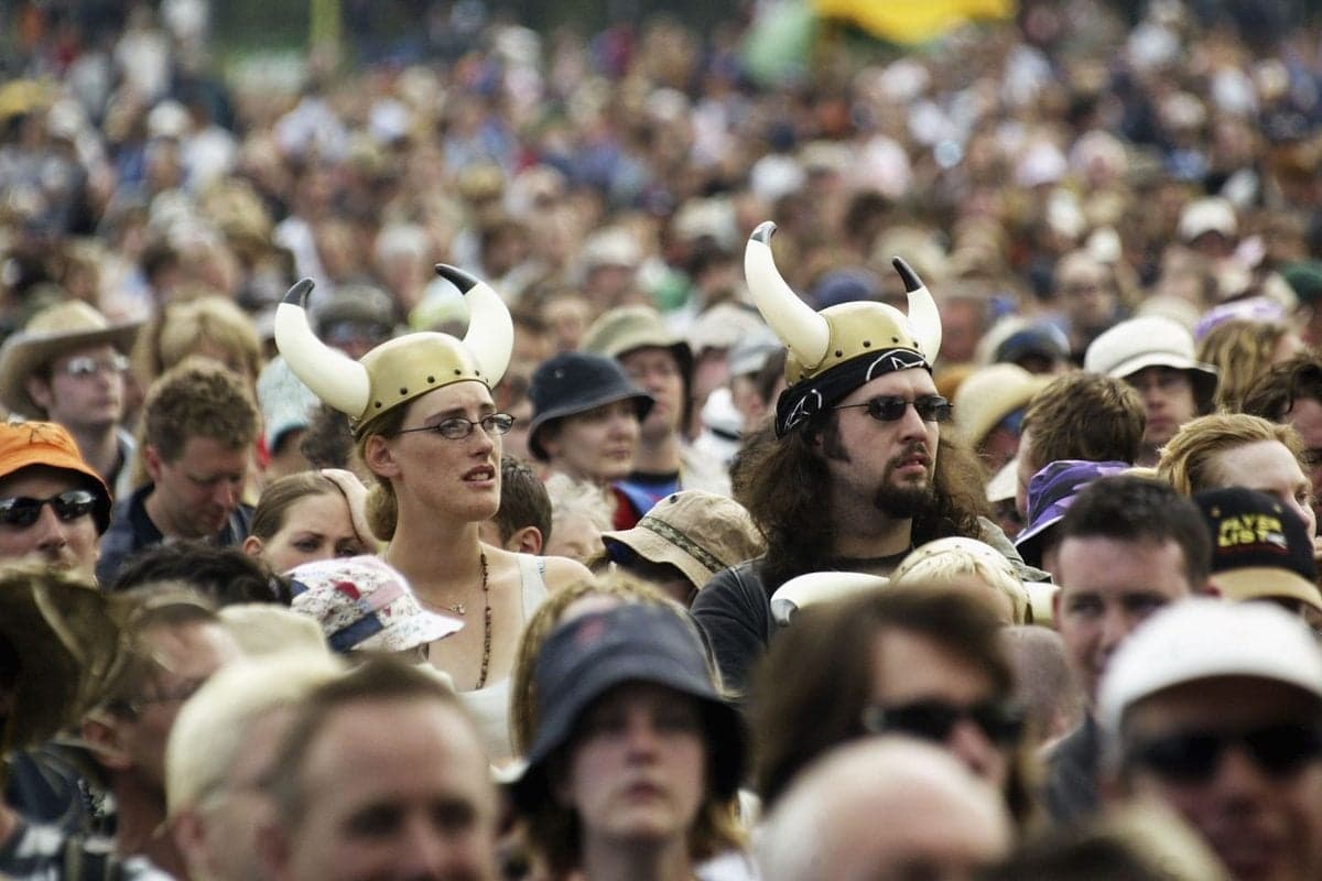 The crowd attending a performance of 'The Valkyrie' by Wagner, being performed at the Glastonbury Festival in 2004.