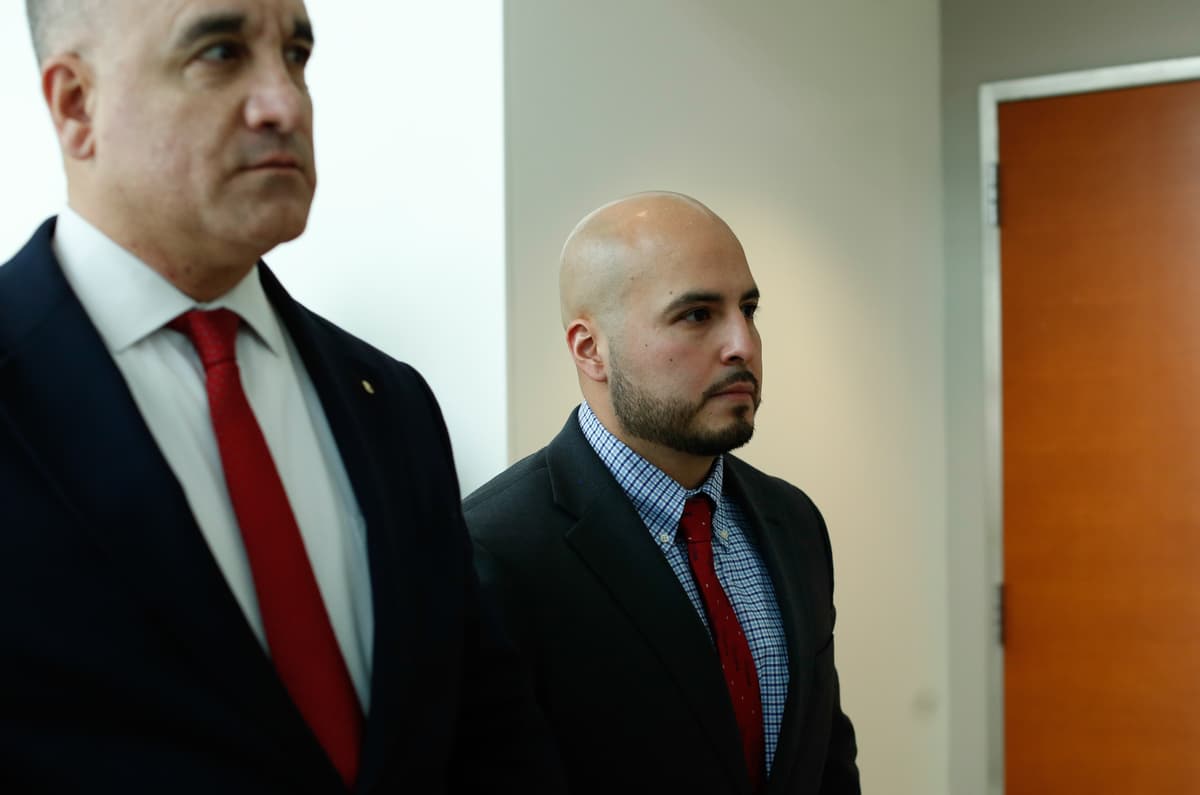 Sergeant Erik Duran of the NYPD, right, in criminal court at the Bronx  February 6, 2026. 