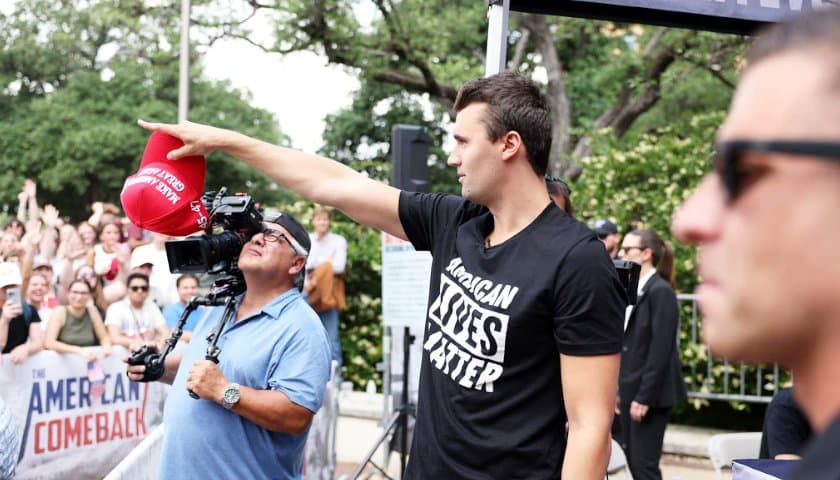 The late conservative activist Charlie Kirk appears at a campus event in mid-2025. 