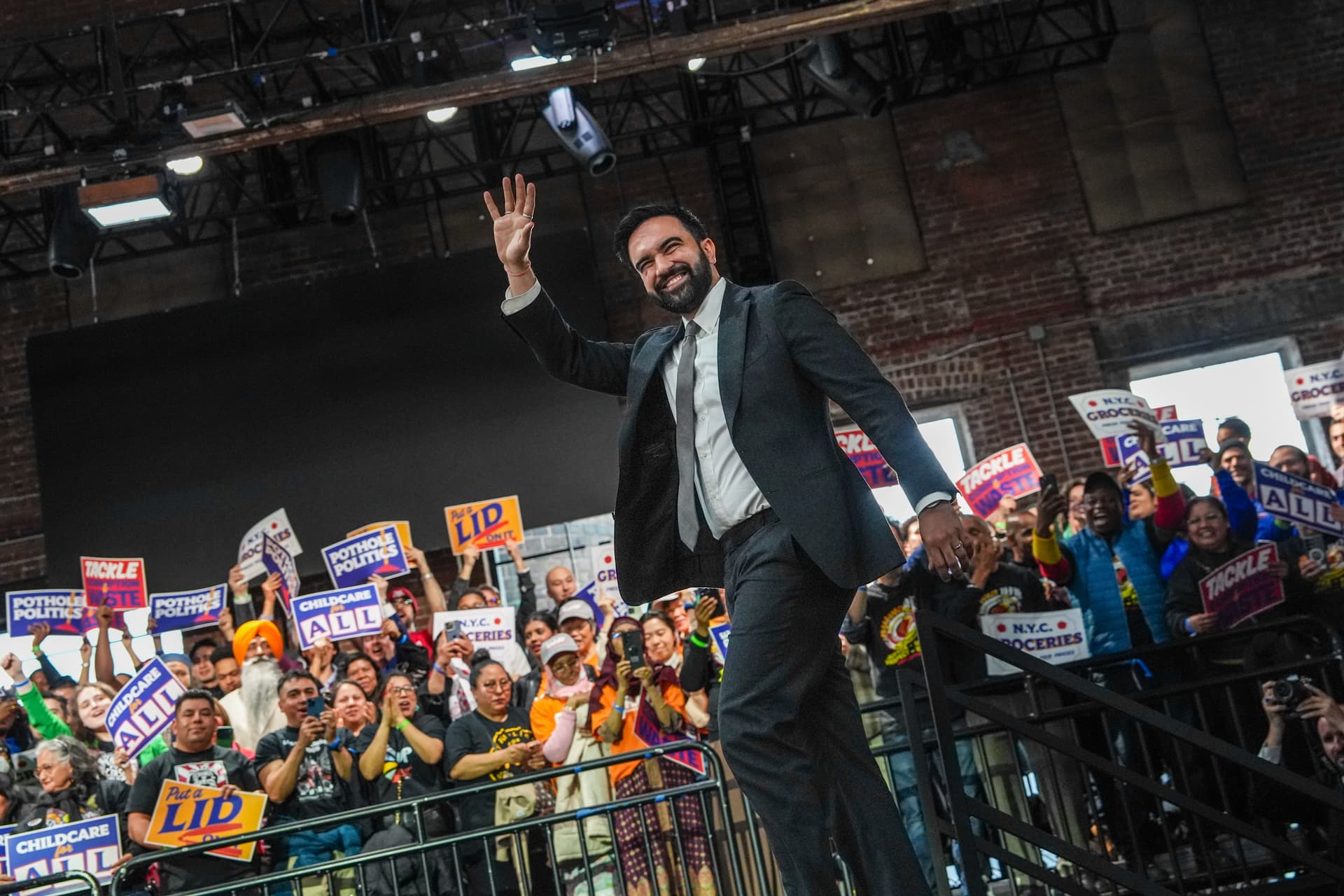 Mayor Zohran Mamdani strides on stage for his 100-day address on April 12, 2026. 