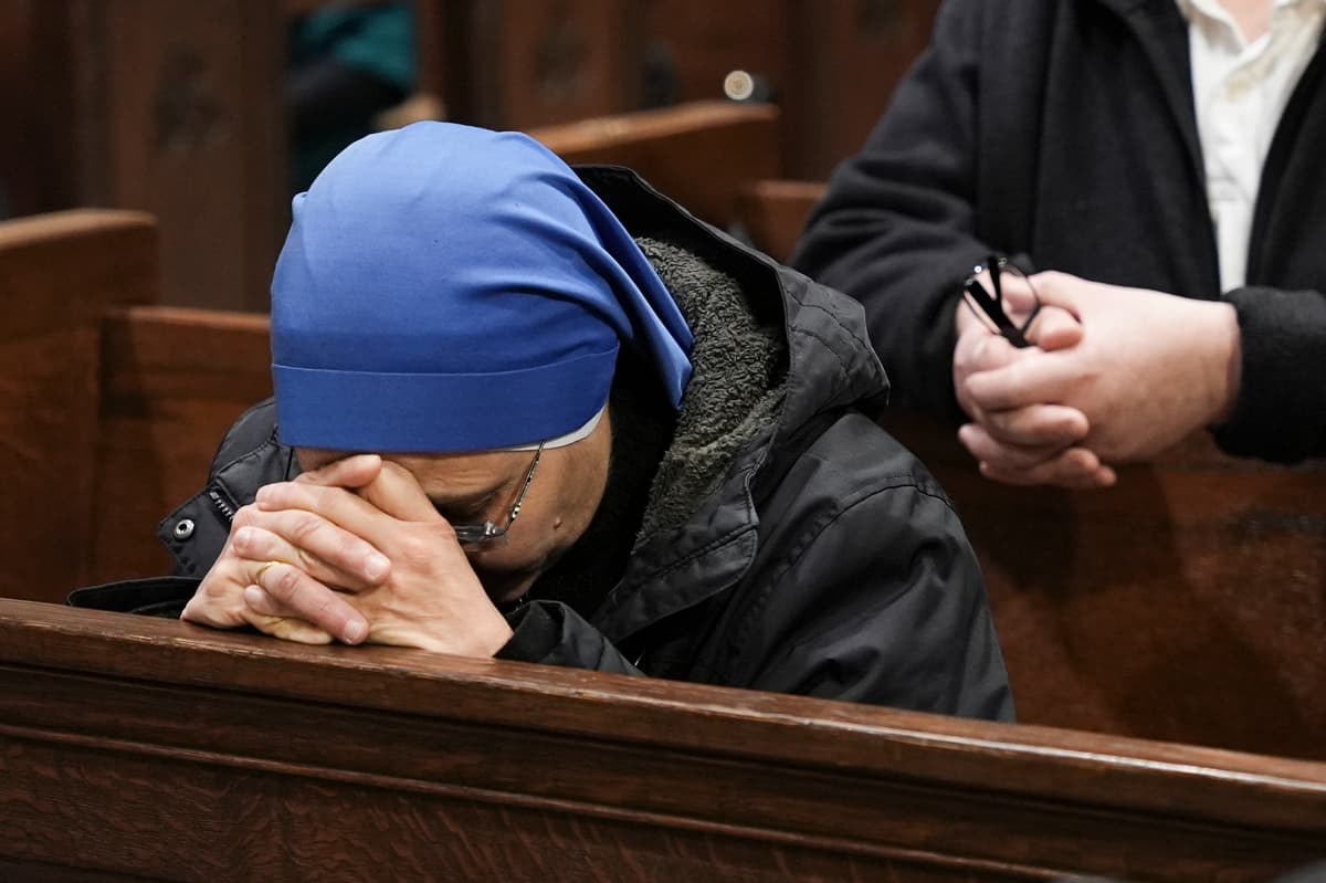 A nun prays during the installation Mass for New York Archbishop-designate Ronald A. Hicks.