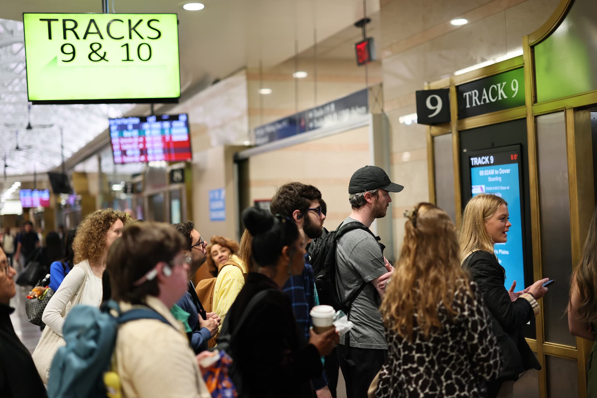 Commuters wait for their train at the NJ Transit section of Penn Station on May 20, 2025 in New York City.