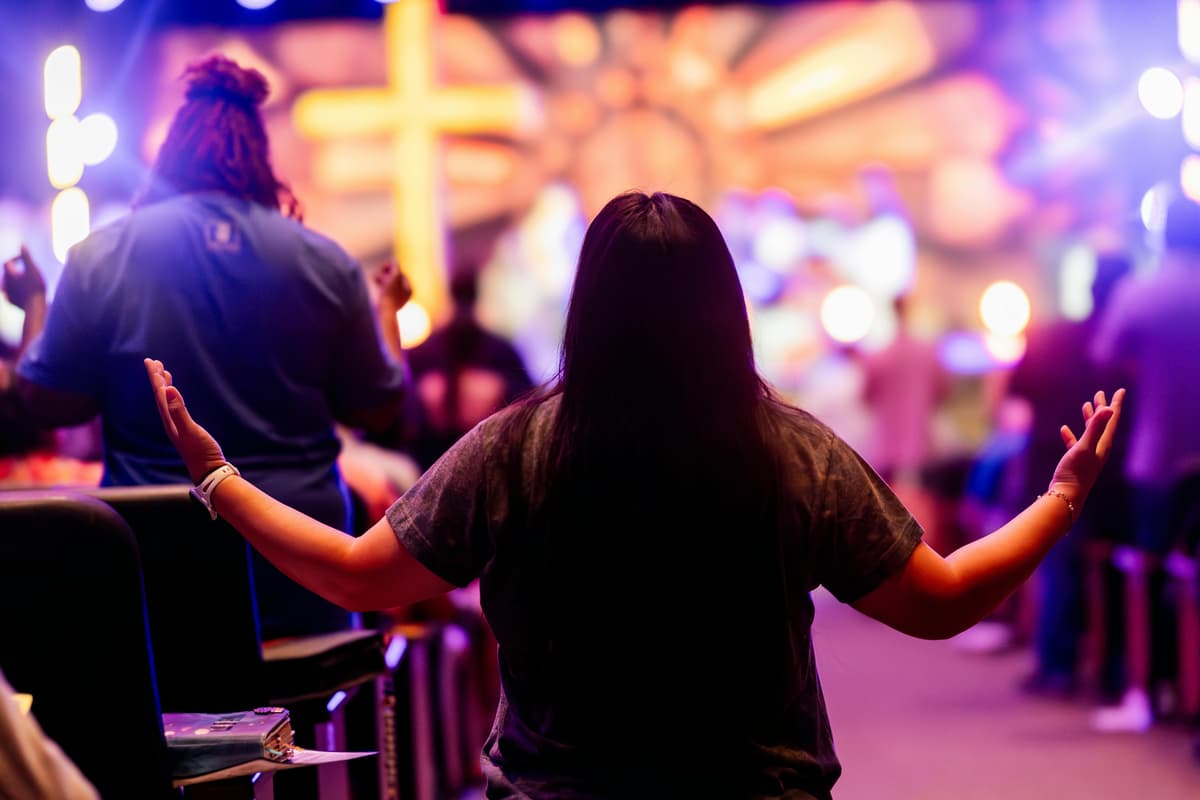 Christian congregants pray during service. A new report shows an uptick in attendance across 80 denominations for the first time in 25 years. 