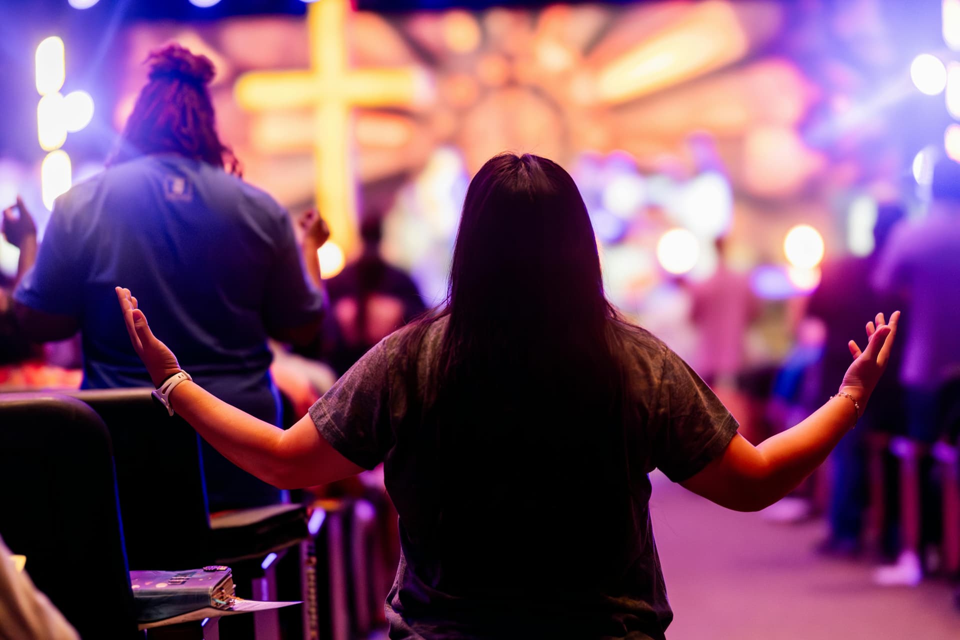 Christian congregants pray during service. A new report shows an uptick in attendance across 80 denominations for the first time in 25 years. 