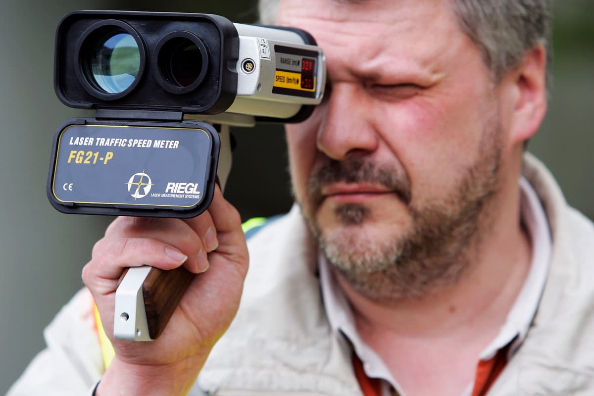 A police officer tests a Laser Traffic Speed Meter.