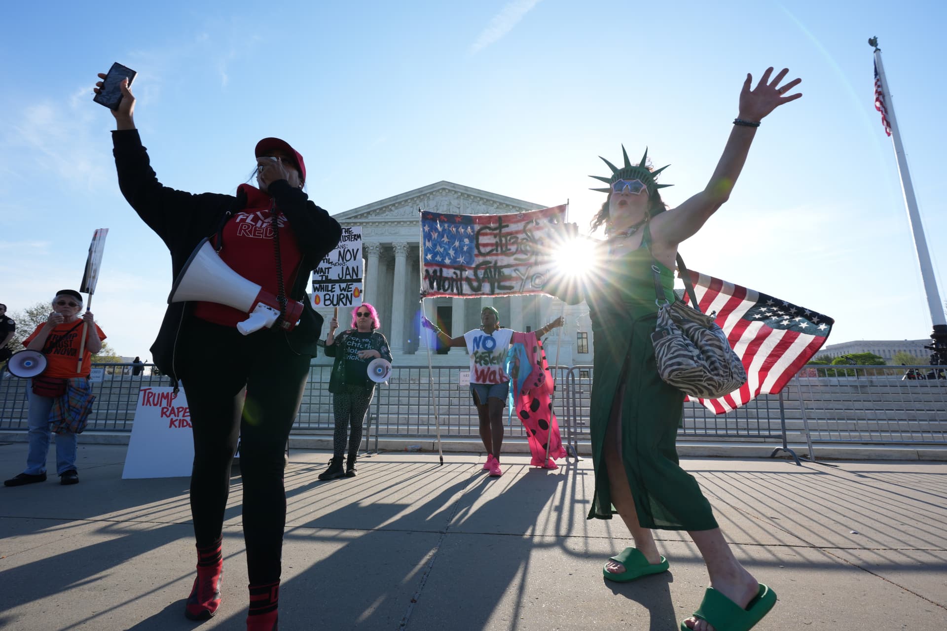 Pro and anti-Trump demonstrators rally outside the U.S. Supreme Court Wednesday.