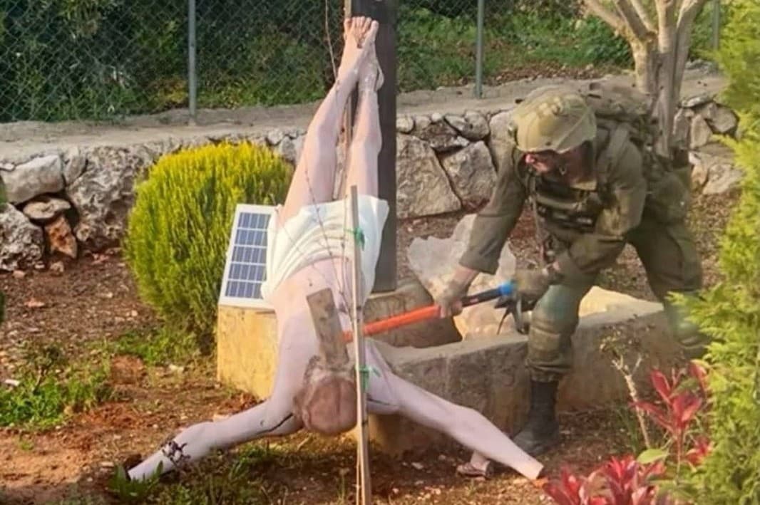 Israel’s military promises “necessary strict measures” against the soldier seen here destroying a Christian icon in an image from southern Lebanon that was widely circulated on social media Sunday.