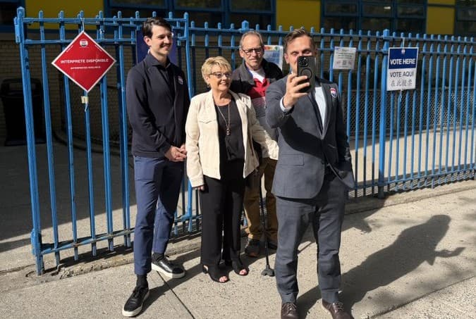 New York City Council candidate Carl Wilson takes a selfie with his partner and parents on April 29, 2026, after his first-place finish in Tuesday’s voting. 