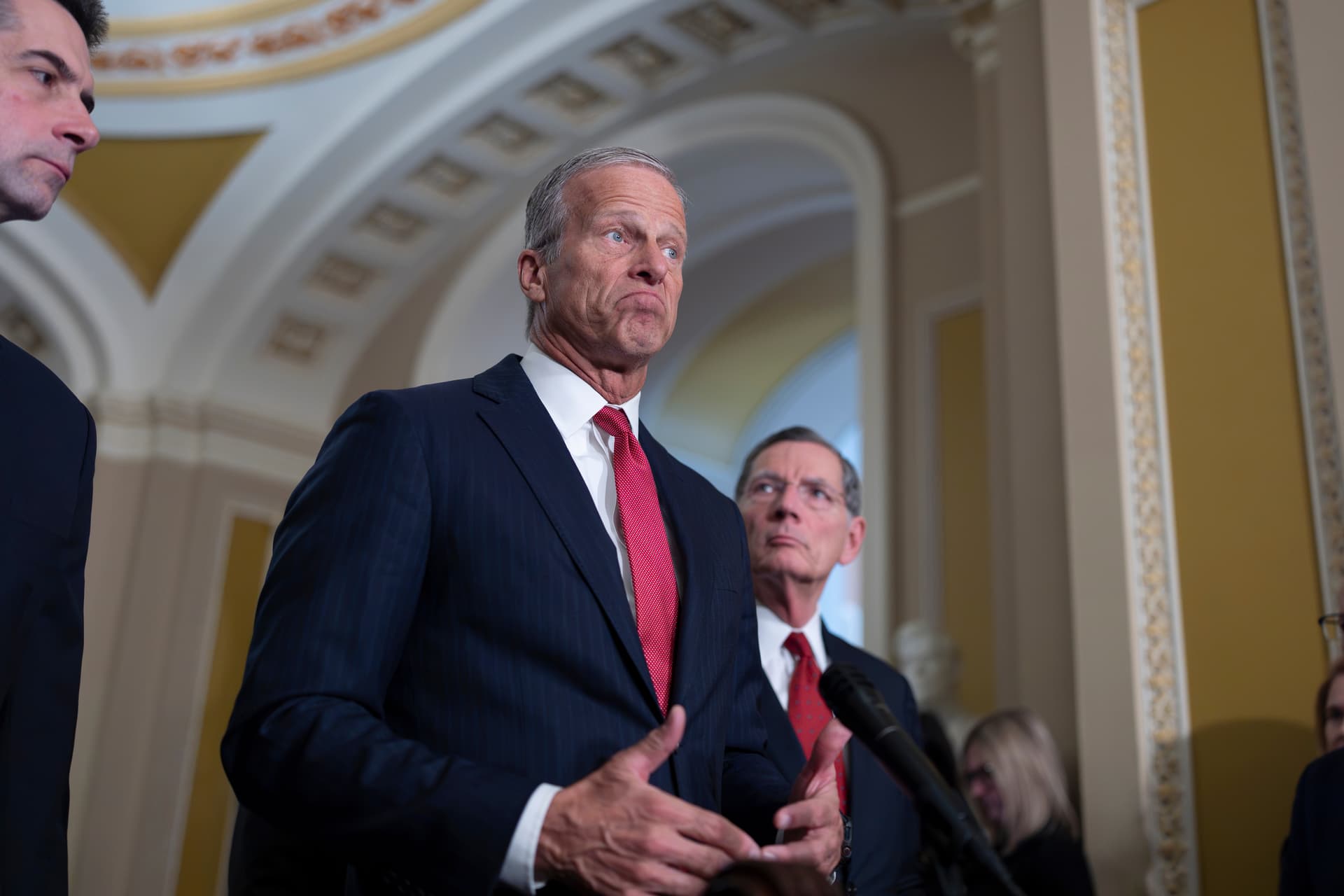 Senate Majority Leader John Thune, flanked by Senators Tom Cotton and John Barrasso, speaks to reporters following a closed-door Republican Party meeting in the Capitol at Washington, April 21, 2026. 