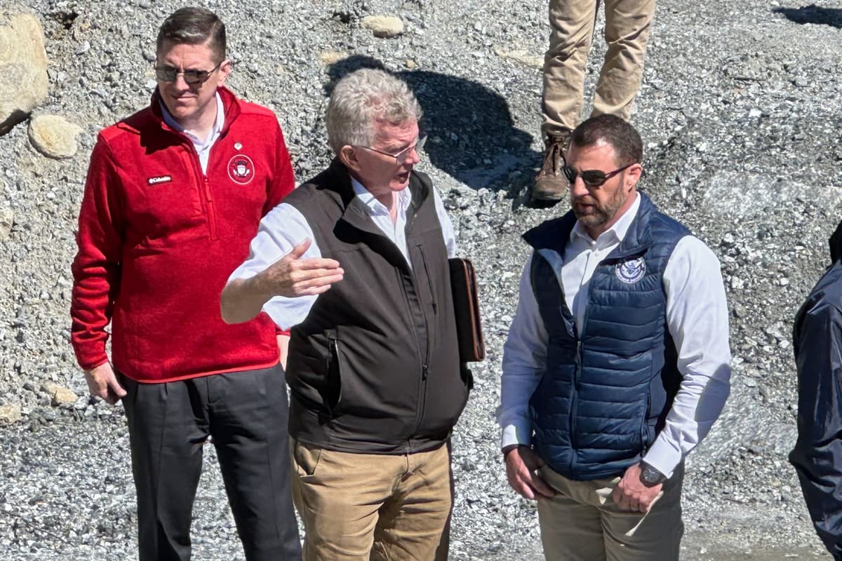 The Homeland Security secretary, Markwayne Mullin, talks with Mayor Peter O'Leary during a visit to survey damage caused by Hurricane Helene at Chimney Rock, North Carolina, on April 7, 2026.