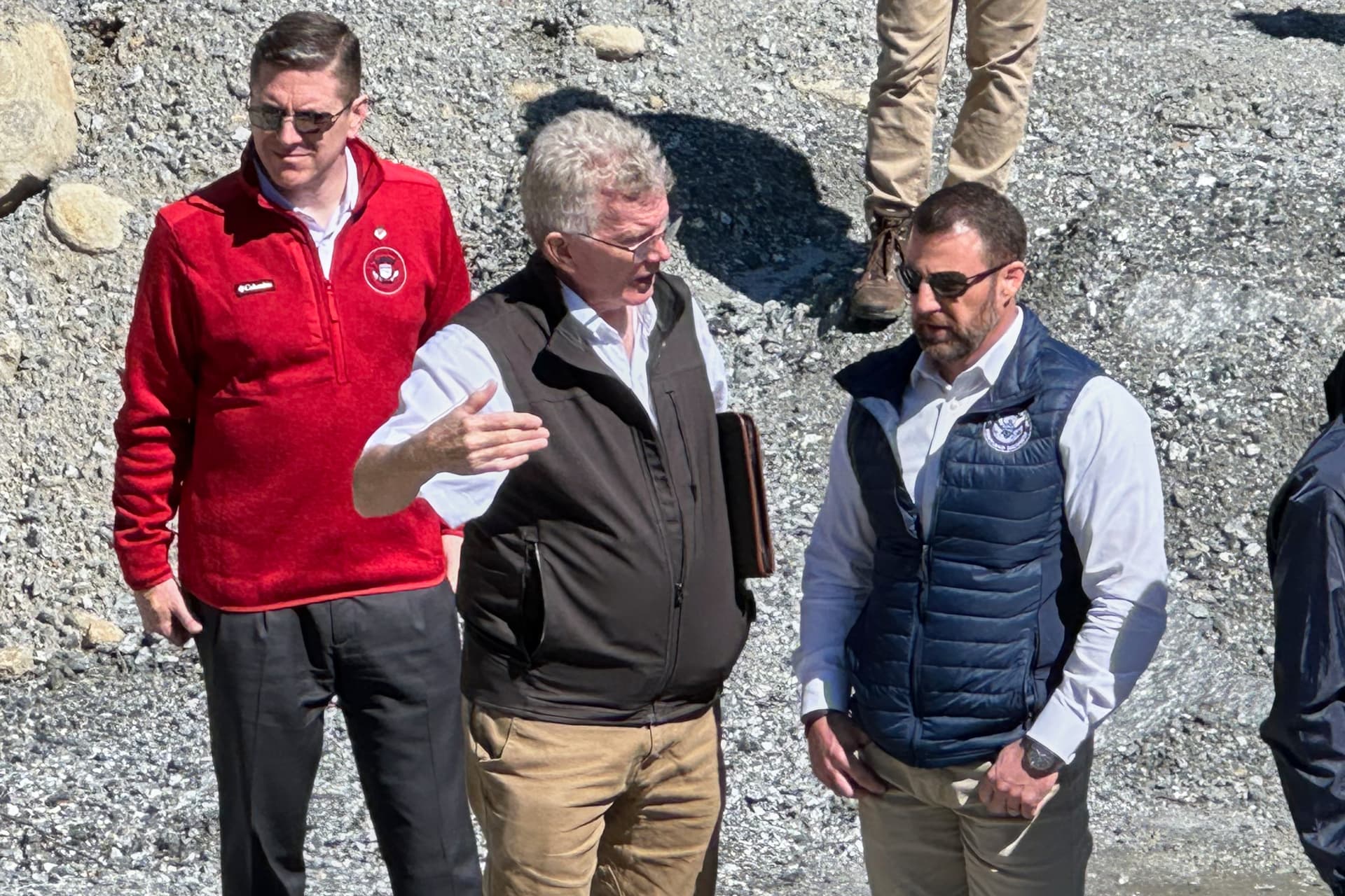 The Homeland Security secretary, Markwayne Mullin, talks with Mayor Peter O'Leary during a visit to survey damage caused by Hurricane Helene at Chimney Rock, North Carolina, on April 7, 2026.