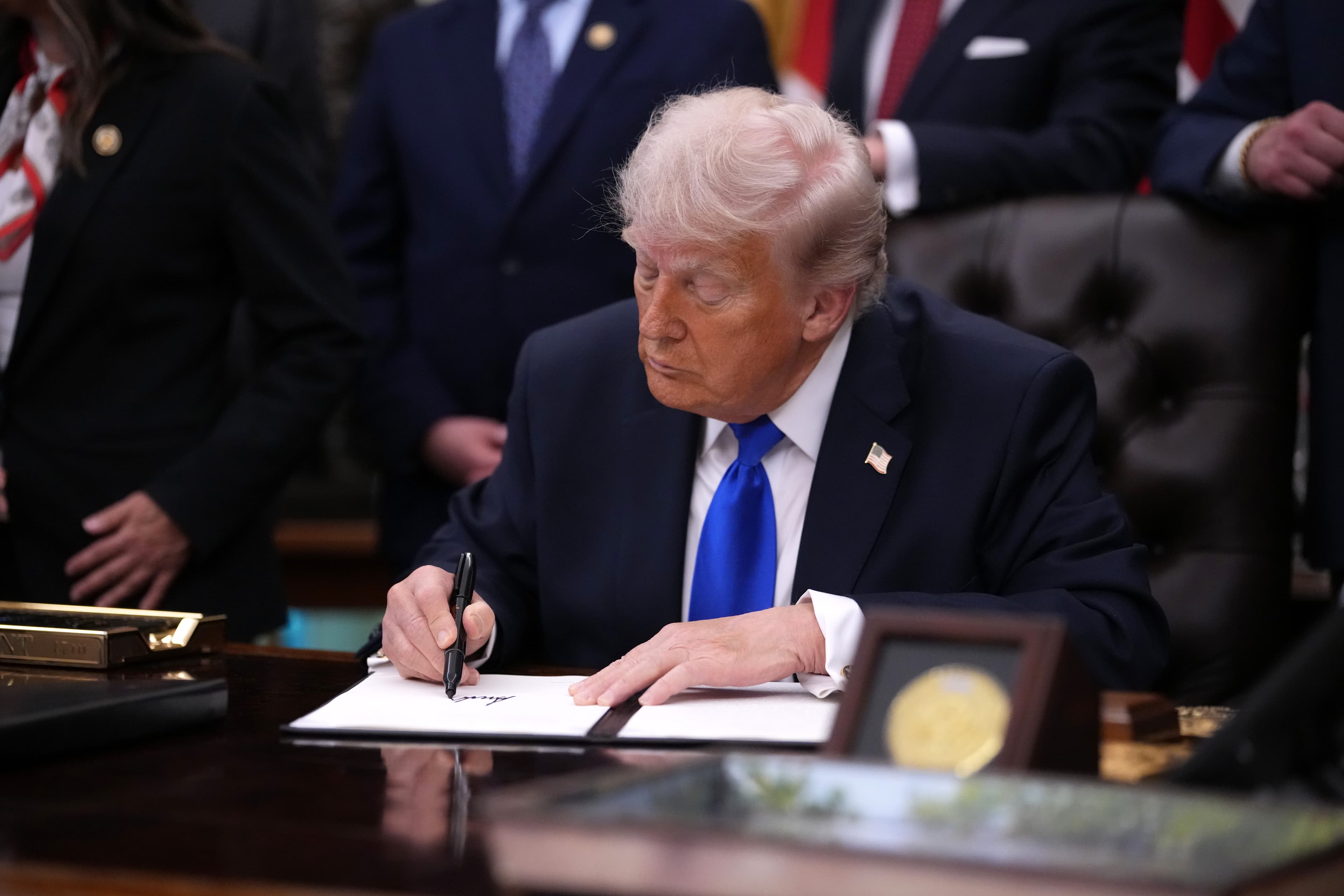President Trump signs  an executive order in the Oval Office of the White House on April 30, 2026. 